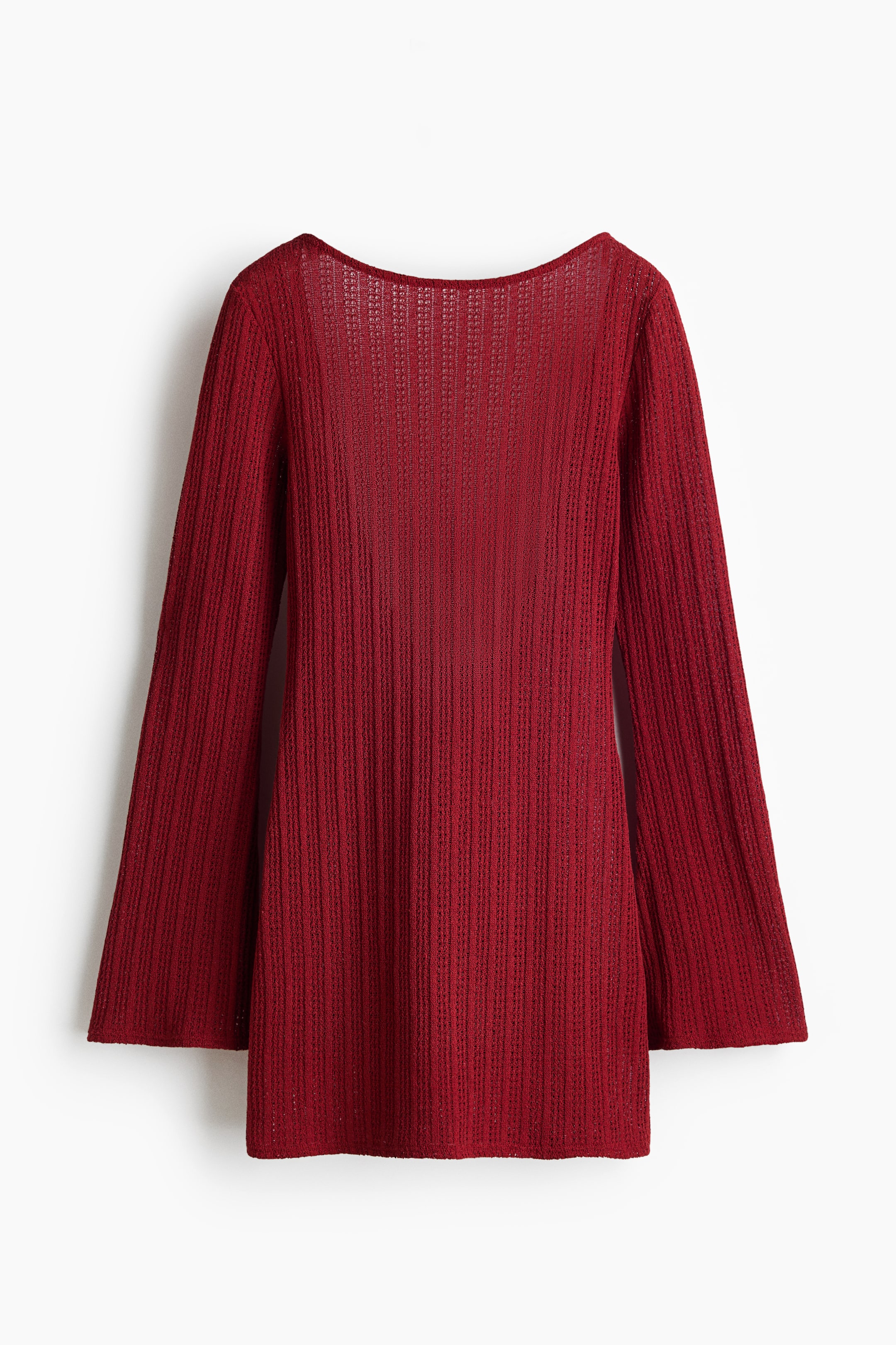 View larger image: "A rich red short beach dress crafted in a textured knit is viewed from the back, showcasing a scoop back and long sleeves with subtly flared cuffs."