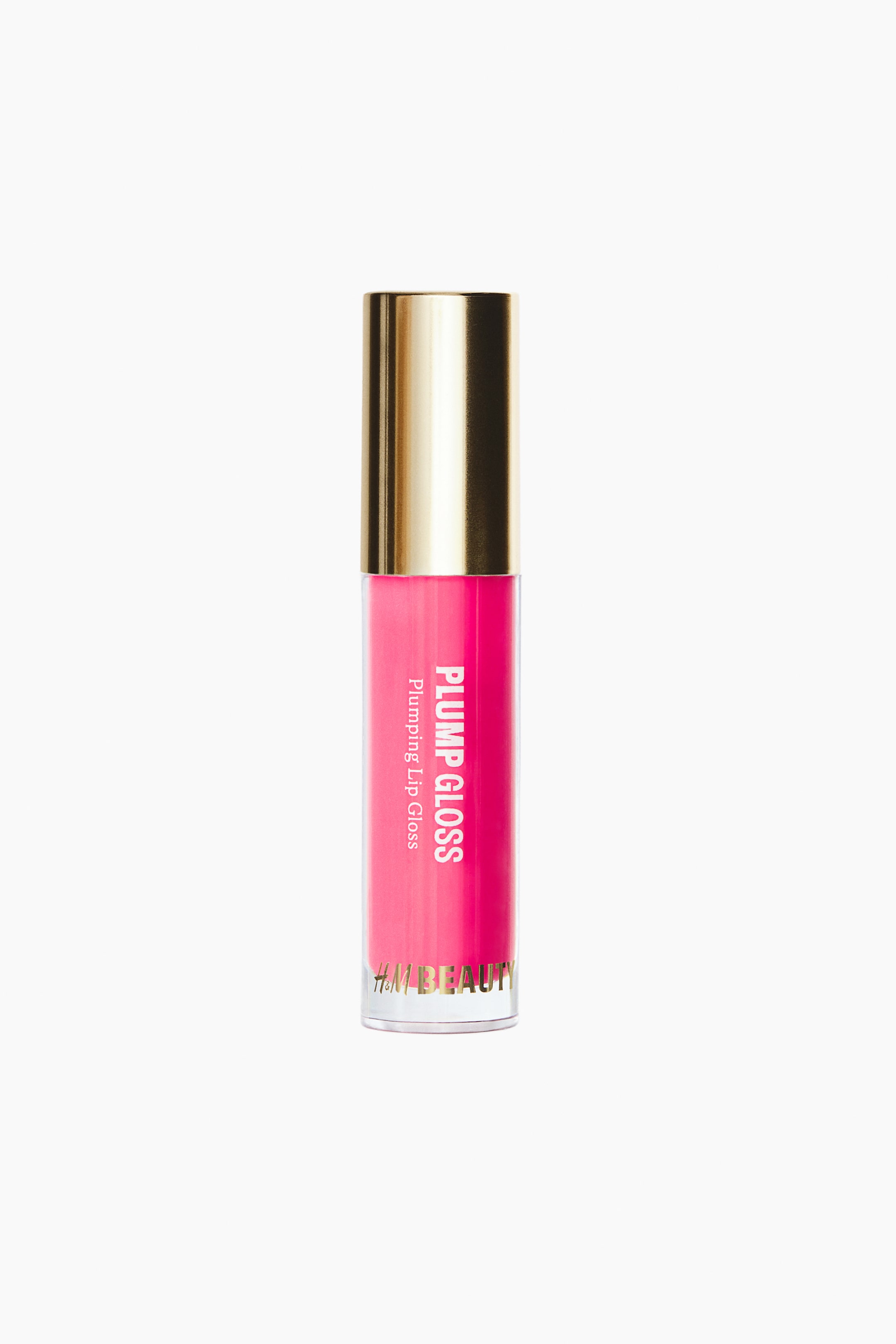 View larger image: A cylindrical tube of plumping lip gloss is standing upright and facing front, showcasing a bright pink formula through its clear container. The tube features a reflective metallic gold cap and white vertical text reading "PLUMP GLOSS," with "H&M BEAUTY" printed in gold lettering near the base.