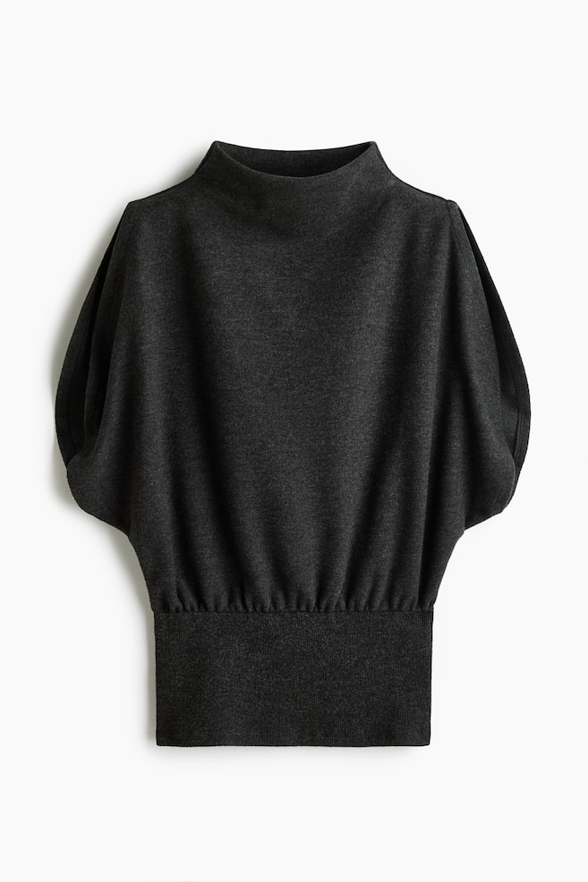 A dark grey knit top is facing the front, featuring a high mock neck, extra-short batwing sleeves, and a wide, fitted waistband with gathering along the top edge. - 1