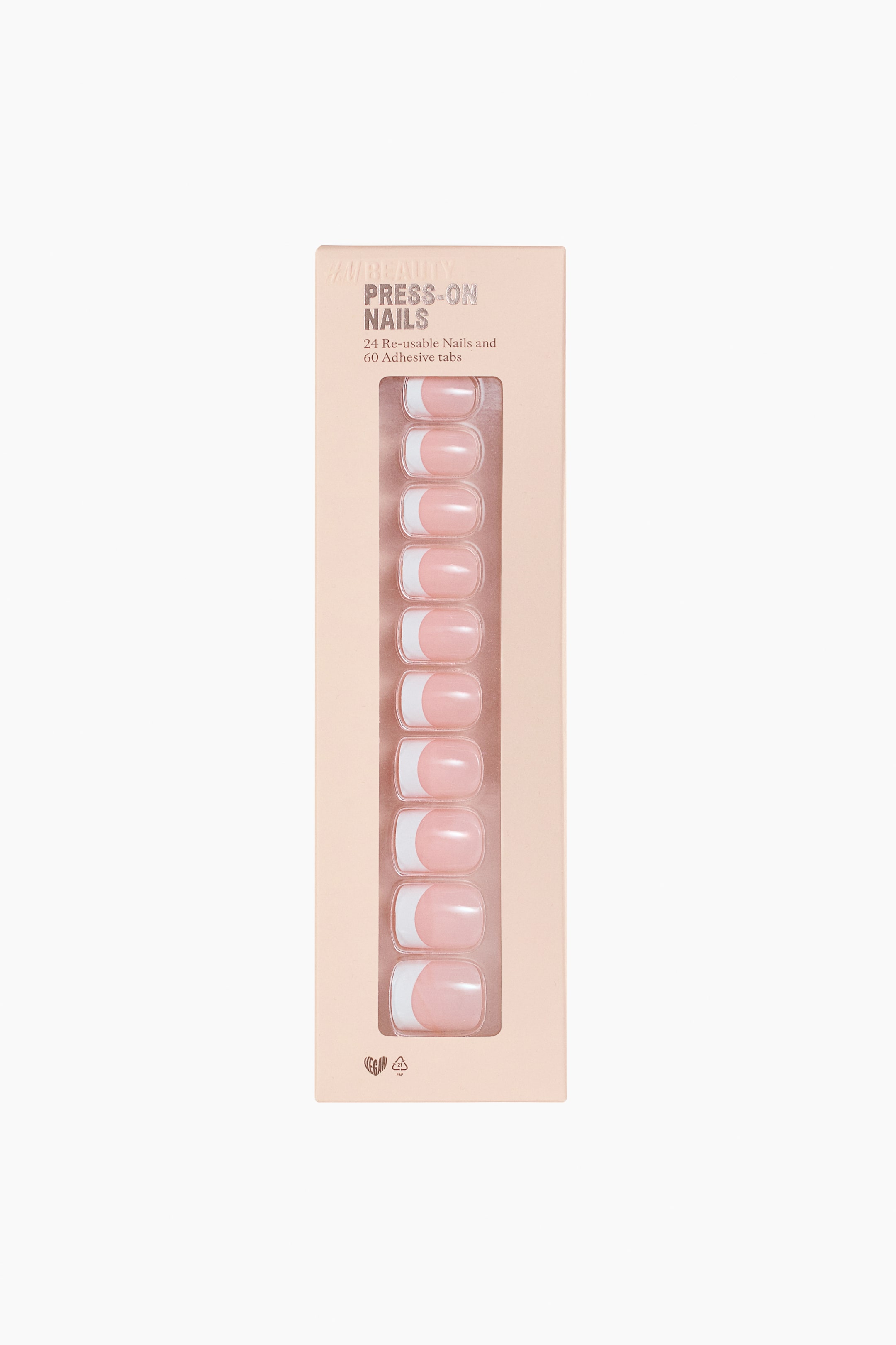 View larger image: The front of a light peach-colored rectangular box is presenting press-on nails. 