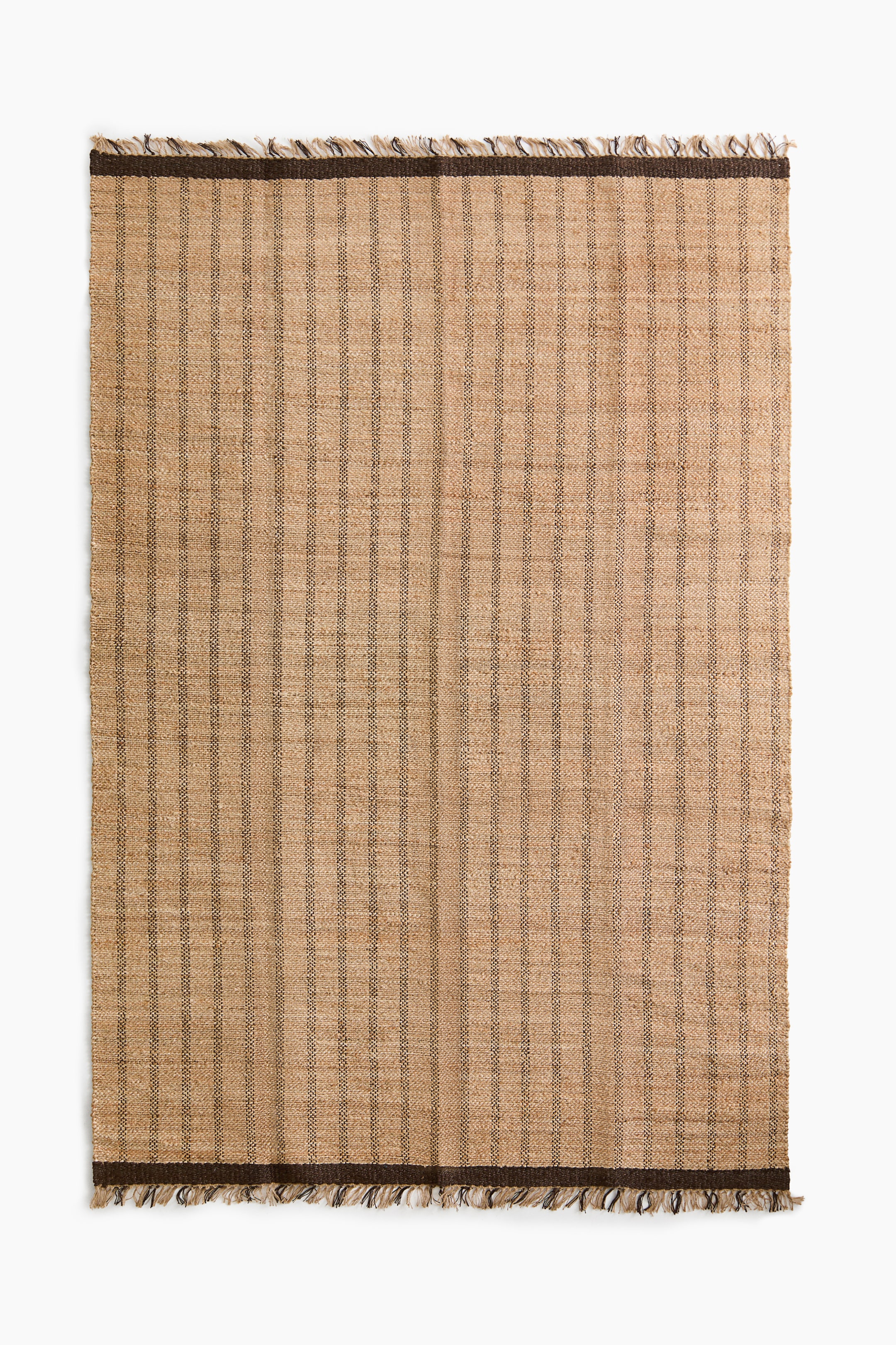 View larger image: A rectangular rug features a natural tan woven material with thin, dark-brown vertical stripes. Solid dark-brown horizontal bands run along the top and bottom, and both ends are finished with a mixed tan and dark-brown fringe.