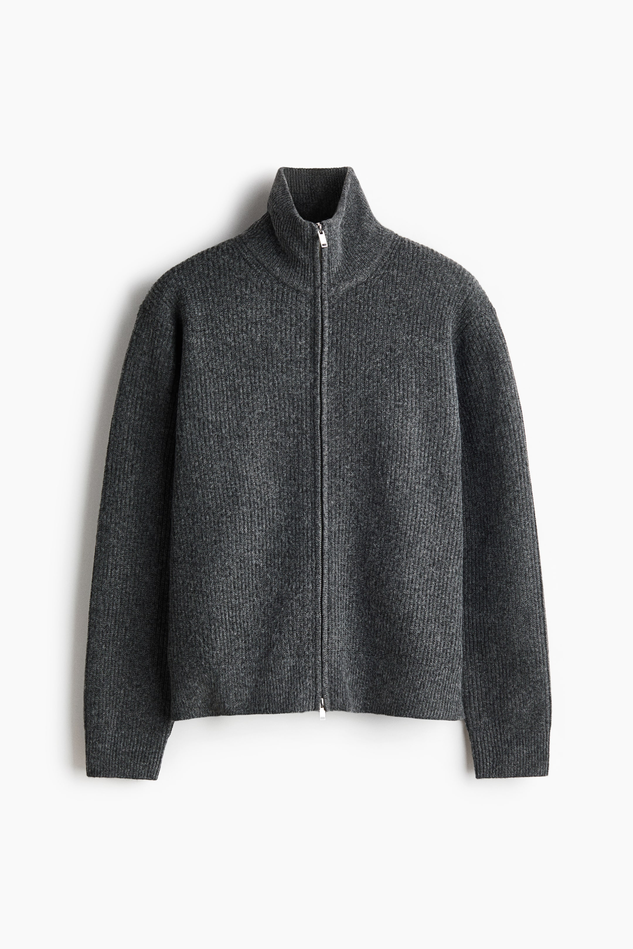 View larger image: A dark grey ribbed knit full-zip sweater is shown from the front, featuring a mock neck collar, long sleeves with ribbed cuffs, and a ribbed hem, with a silver-toned zipper closure running down the centre.