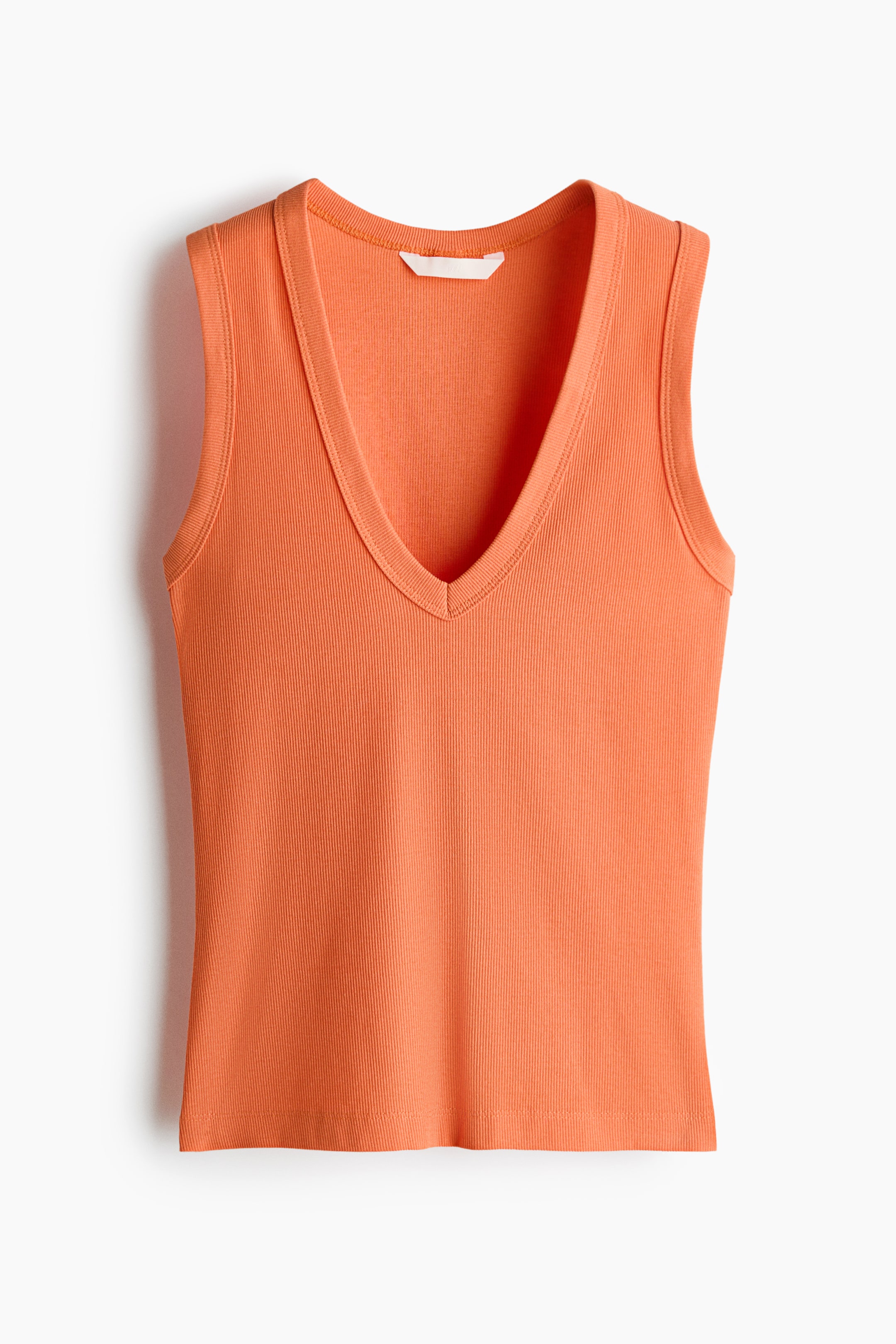 View larger image: Front view of a tailored vest top featuring an orange ribbed jersey fabric, a deep V-neckline, and slim trims around the neckline and armholes.