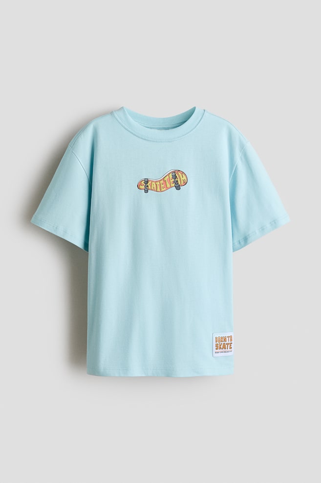 T-shirt imprimé en coton - Turquoise clair/Stay Chill/Gris clair chiné/Skate Crew/Ivoire/Racing Team/Crème/burger/Ivoire/Skater Snacks/Rose pâle/Forever in Control - 1