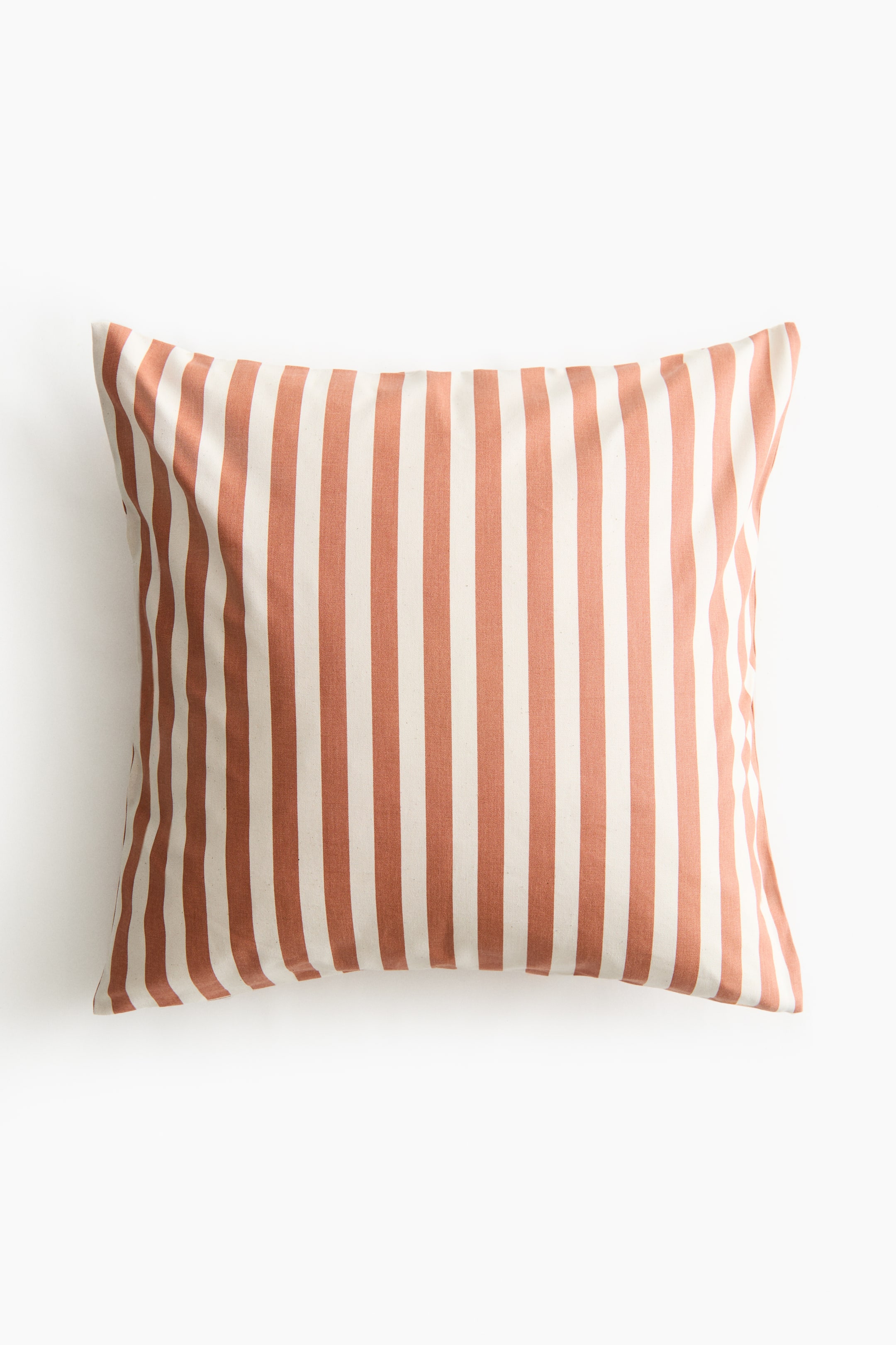 View larger image: A rectangular cushion cover is shown from the front, featuring alternating vertical stripes in light beige and terracotta and a textured, canvas-like fabric.