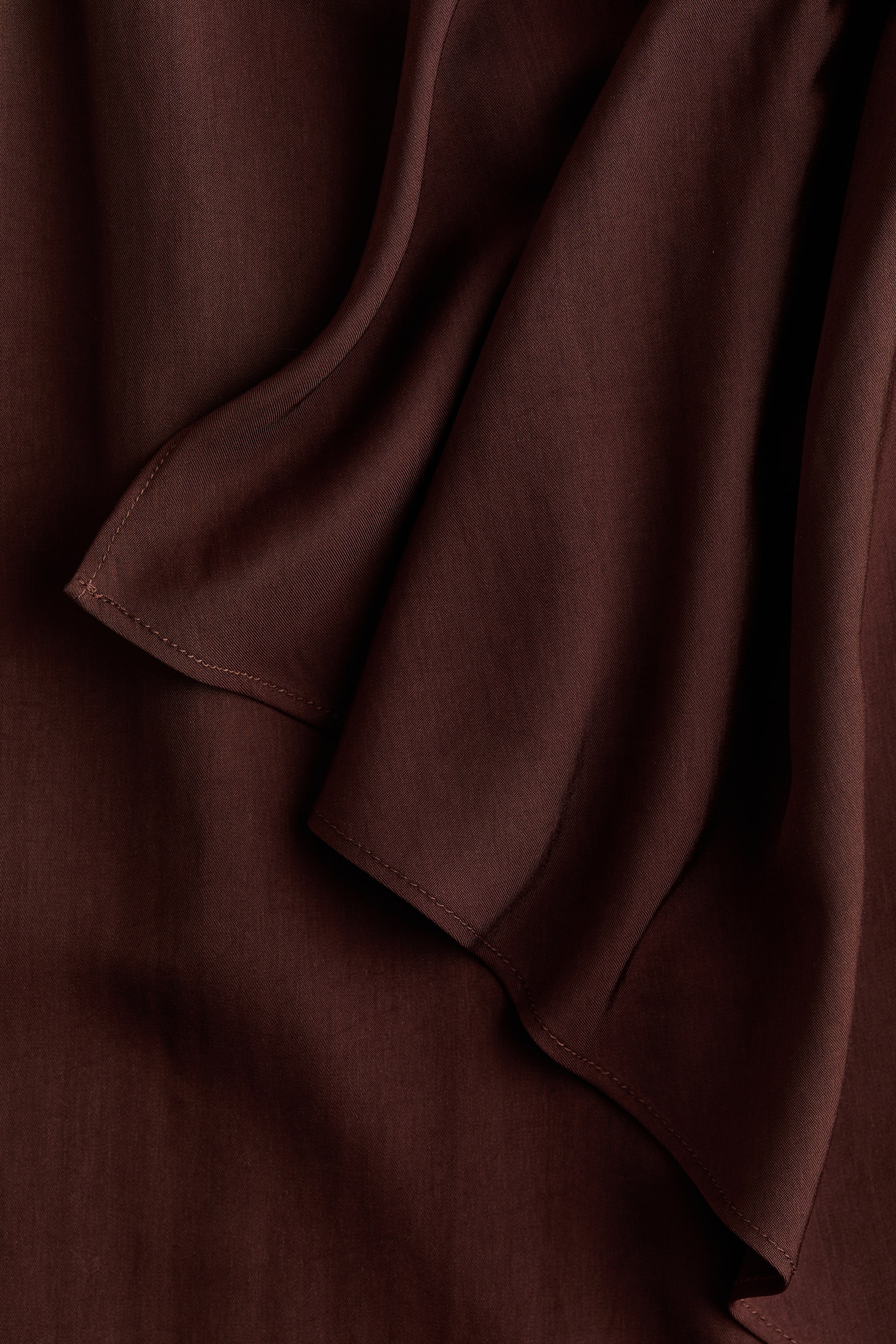 Jupe asymétrique avec panneau drapé