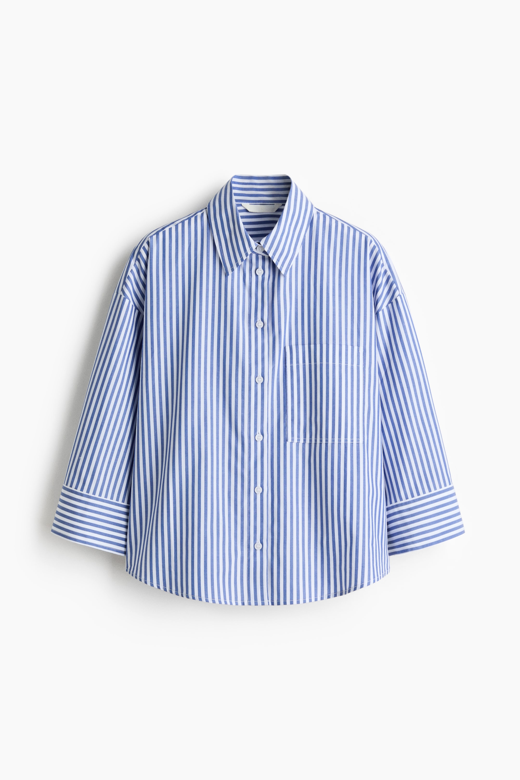 View larger image: The front of a blue-and-white striped shirt features a pointed collar, a button-front closure, a single patch pocket on the left chest, three-quarter-length sleeves with wide cuffs, and a curved hem.