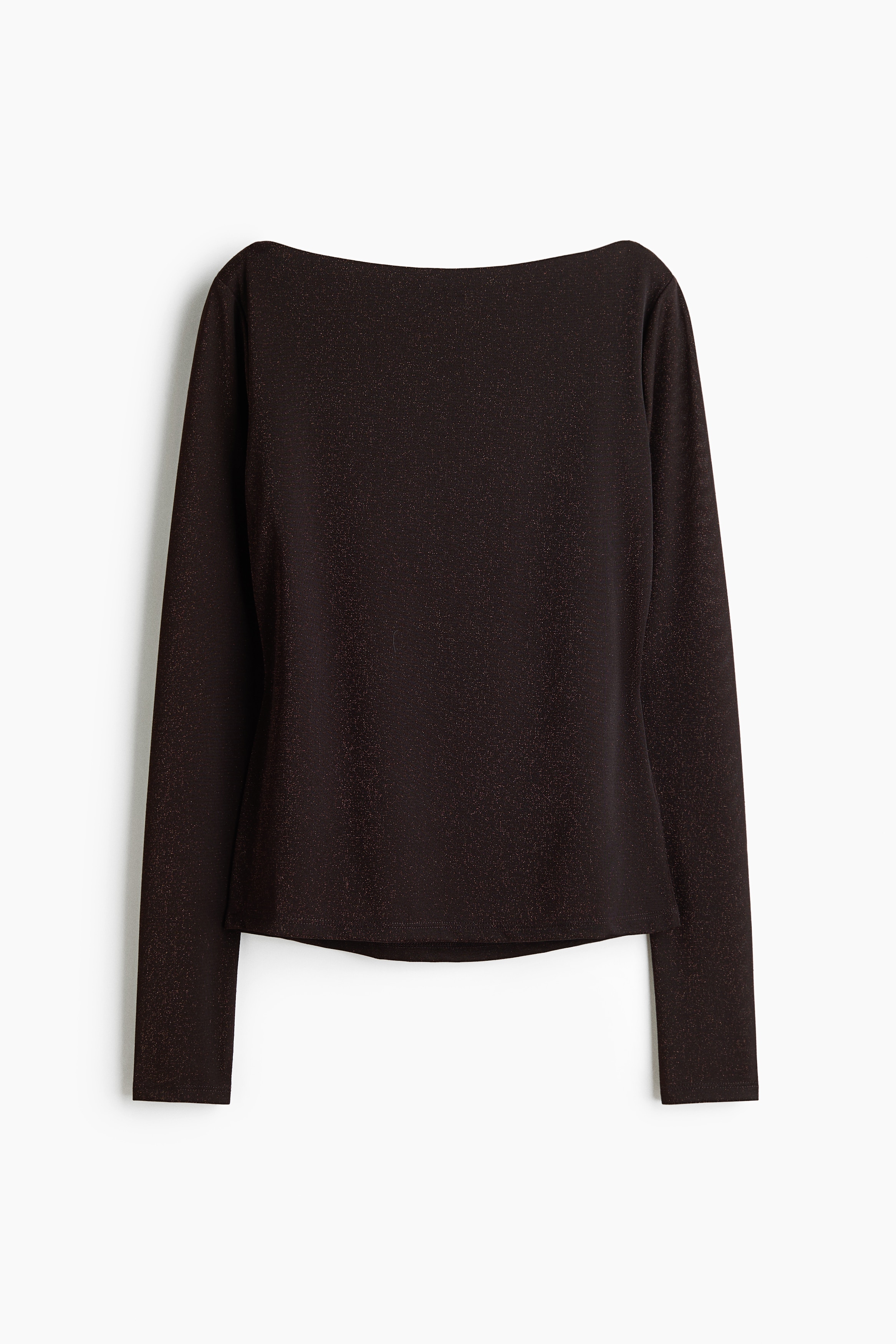 A dark, fitted long-sleeved top with a boat neckline is worn by the model, who is posing with one hand resting on the opposite shoulder. The top is paired with dark trousers, visible at the waist.