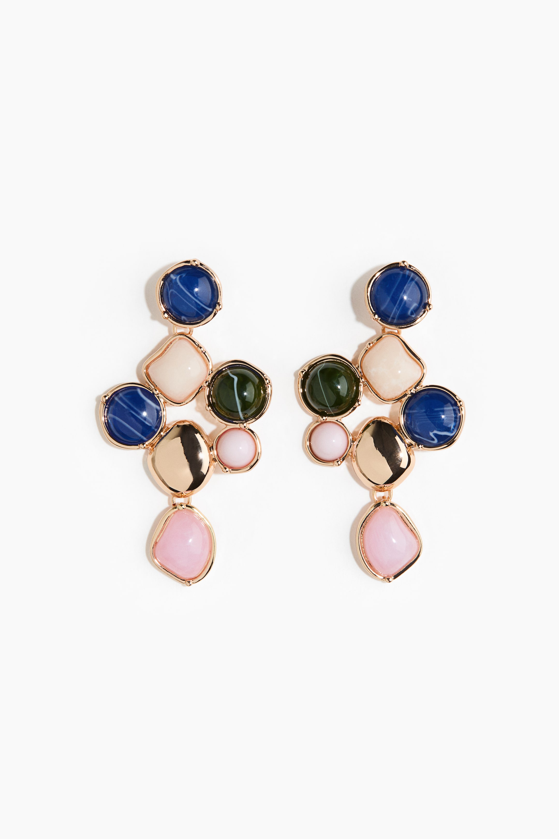 View larger image: A pair of earrings showcases multiple colourful cabochons set in gold-toned metal, arranged vertically. Each earring features round, irregular square, and irregular oval cabochons in shades of dark blue, cream, dark green, and light pink, interspersed with polished gold-toned elements.