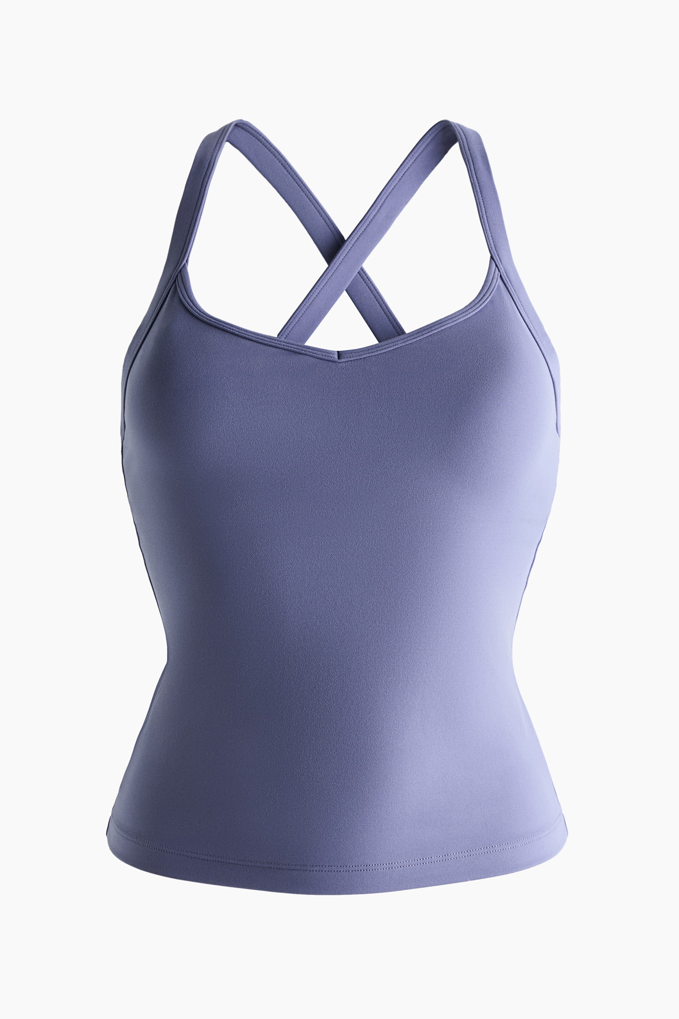View larger image: A periwinkle blue tank top is shown front-facing, featuring a fitted silhouette, a sweetheart neckline, and criss-cross straps visible over the shoulders.