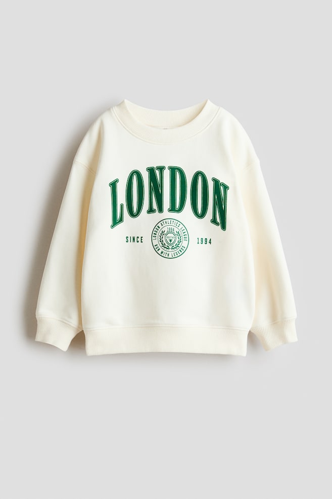 Bedrucktes Sweatshirt mit Rundausschnitt - Cremefarben/London/Marineblau/Aspen/Hellgraumeliert/Paris/Schwarz/Sports dept./Dunkelgrau/Sports - 1