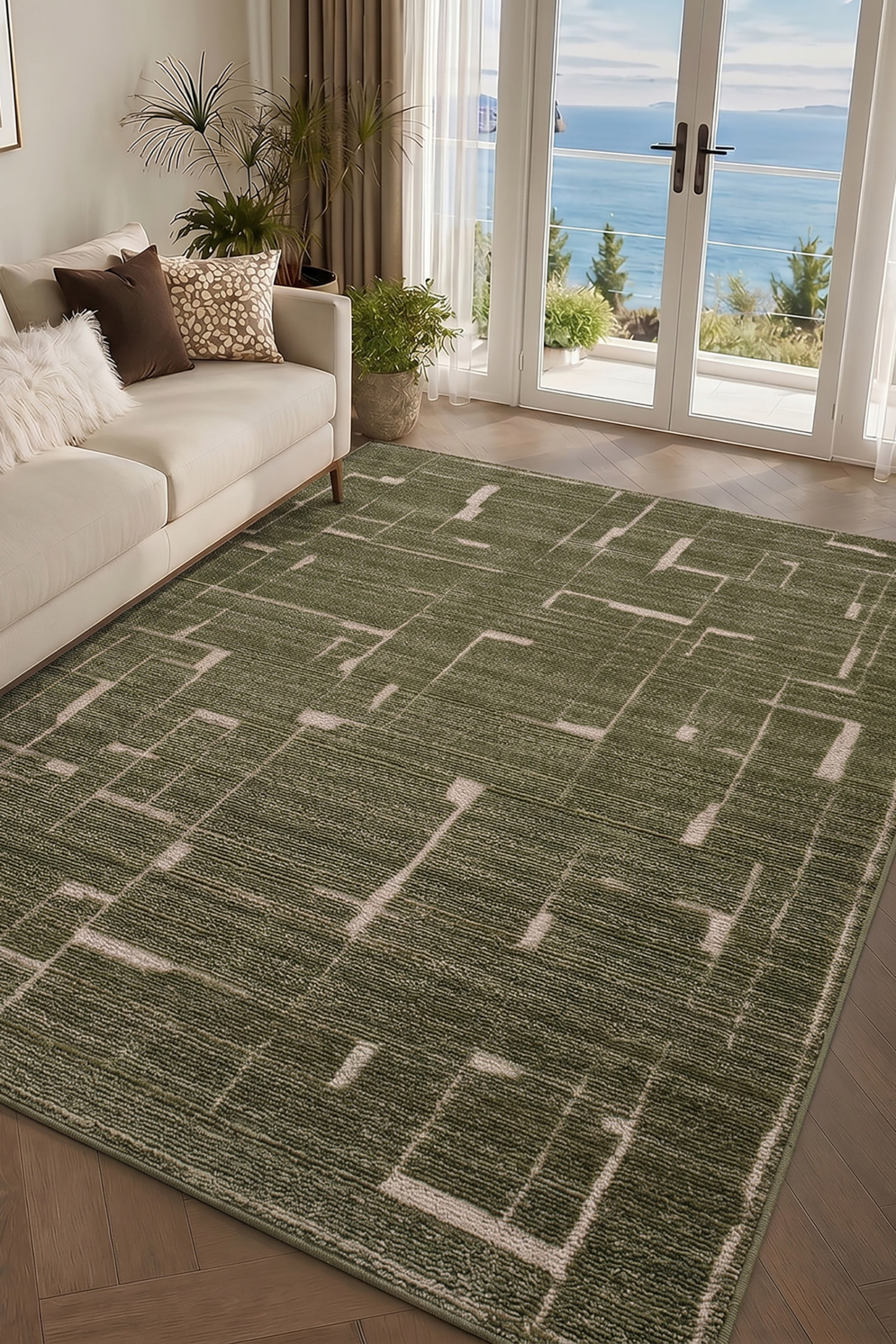 View larger image: A rectangular olive green area rug is showing a textured, ribbed surface with a modern geometric pattern. Intersecting off-white lines are creating an abstract, grid-like design across the low-pile rug.