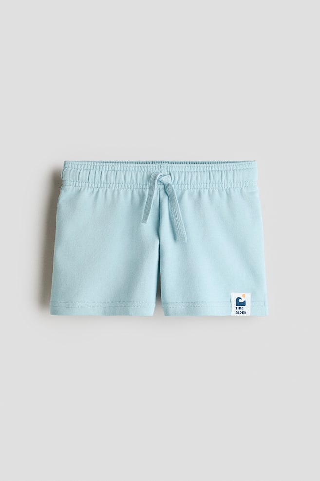 Calções sweat em algodão - Turquesa claro/Azul/Bolas de futebol/Turquesa escuro/Riscas/Bege claro/Dinossauros/Cinzento escuro/Azul vivo/Riscas/Castanho/Riscas - 1