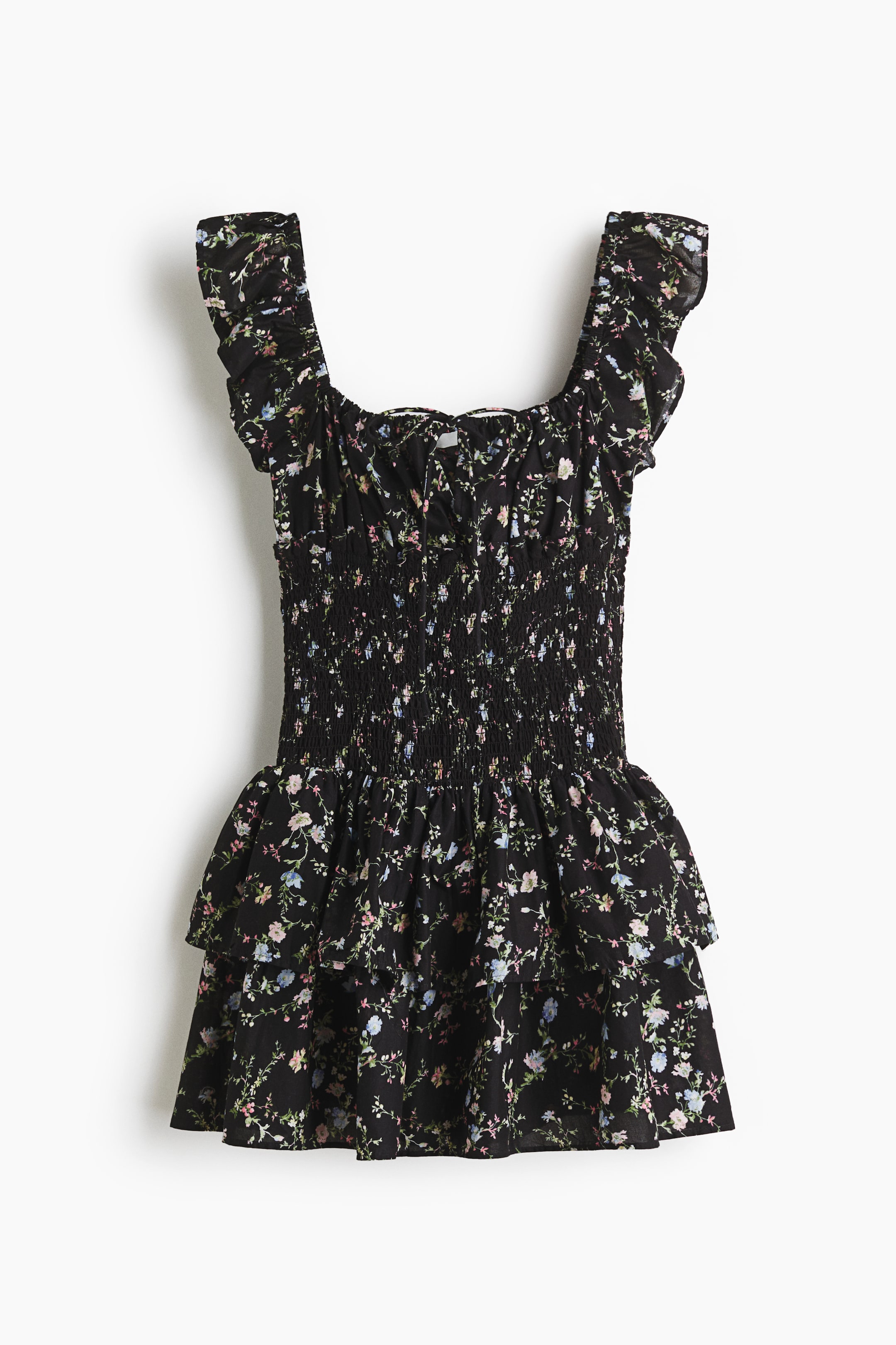 View larger image: This dress showcases a black fabric adorned with a small, multicolored floral pattern. It features a square neckline, a central drawstring tie, ruffled cap sleeves, a shirred bodice, and a tiered, gathered skirt.
