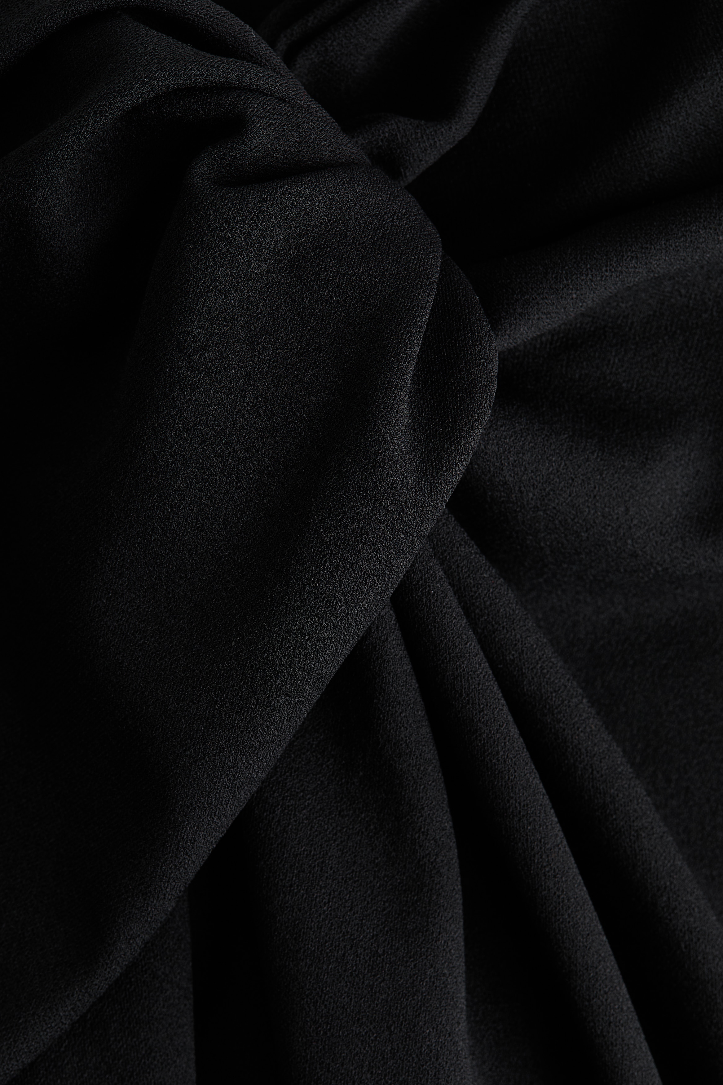 Twisted-detail trousers