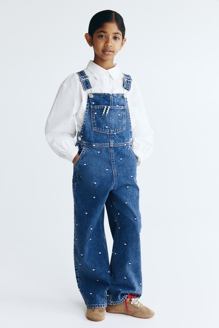 Dezenirane teksas pantalone na tregere