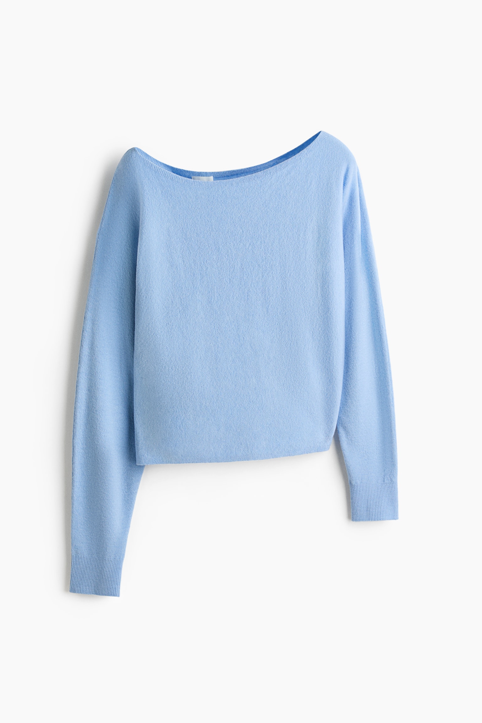 A short, light blue fine-knit sweater is shown from the front, featuring an asymmetrical neckline and long sleeves with ribbed cuffs.