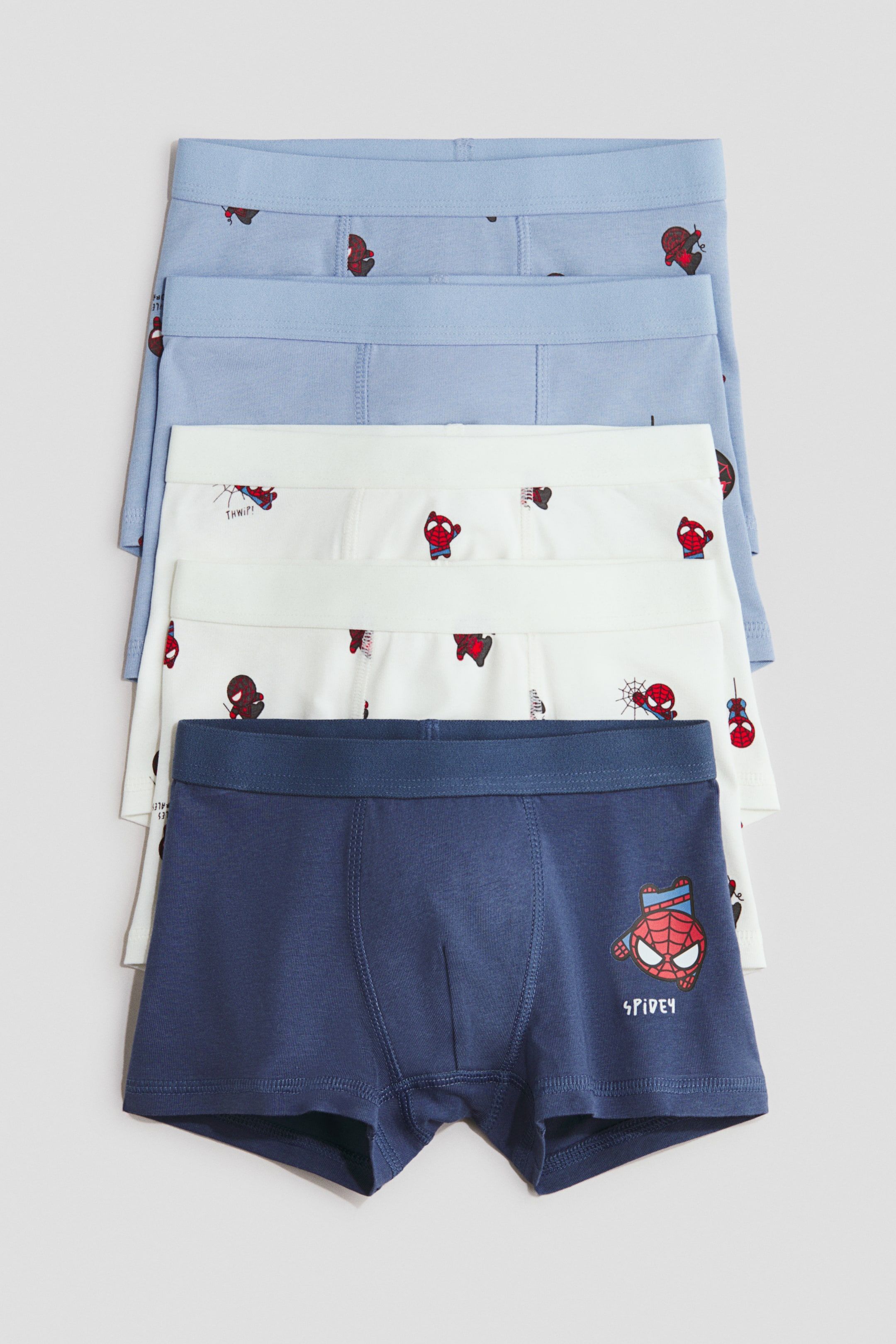 View larger image: Five pairs of boys' boxer briefs are neatly stacked, showing their front side. The top two light blue and two white pairs feature small, repeating Spider-Man character motifs, with some including the 'THWIP!' text. The bottom navy blue pair displays a larger Spider-Man graphic and 'SPIDEY' text on the left leg, with all pairs having elastic waistbands.