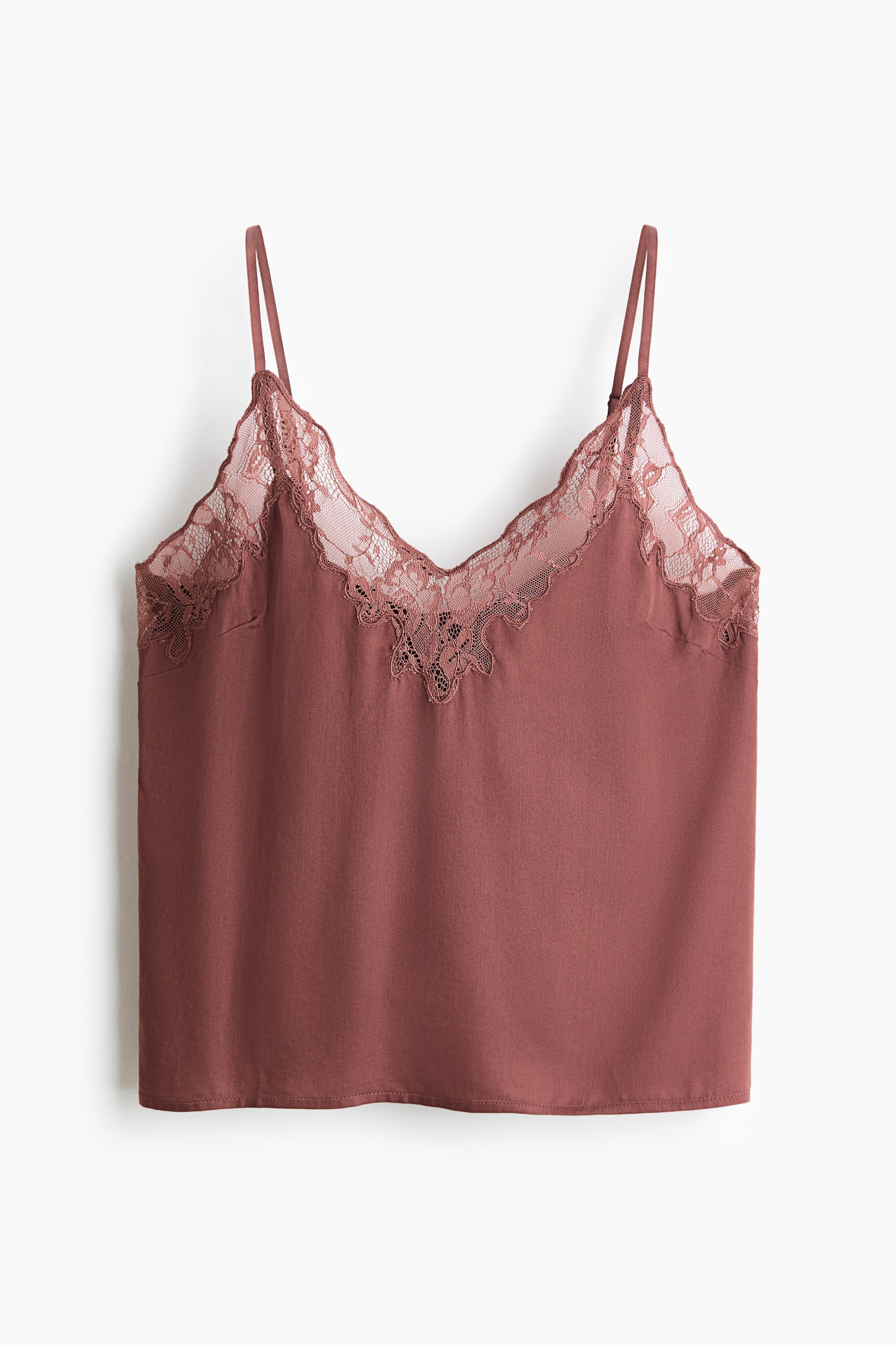 View larger image: A dusty rose camisole is showcasing a V-neckline, adorned with matching-colored lace trim. The lace trim features a scalloped edge and an intricate central pattern, while thin spaghetti straps extend from the top.