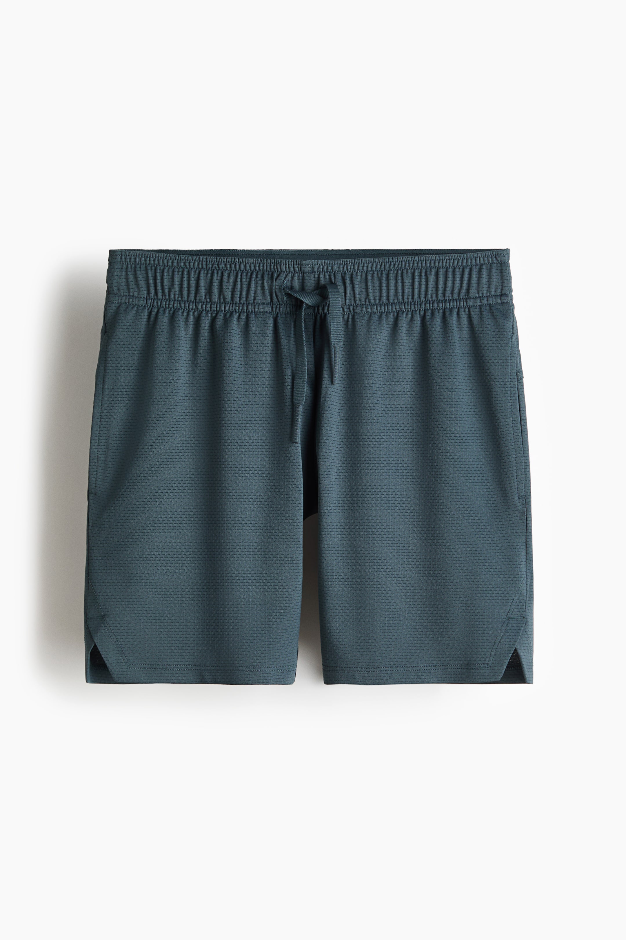 View larger image: Teal athletic shorts are shown from the front, featuring a textured fabric, an elasticated waistband with a visible drawstring, side-slit pockets, and small side vents at the hem.