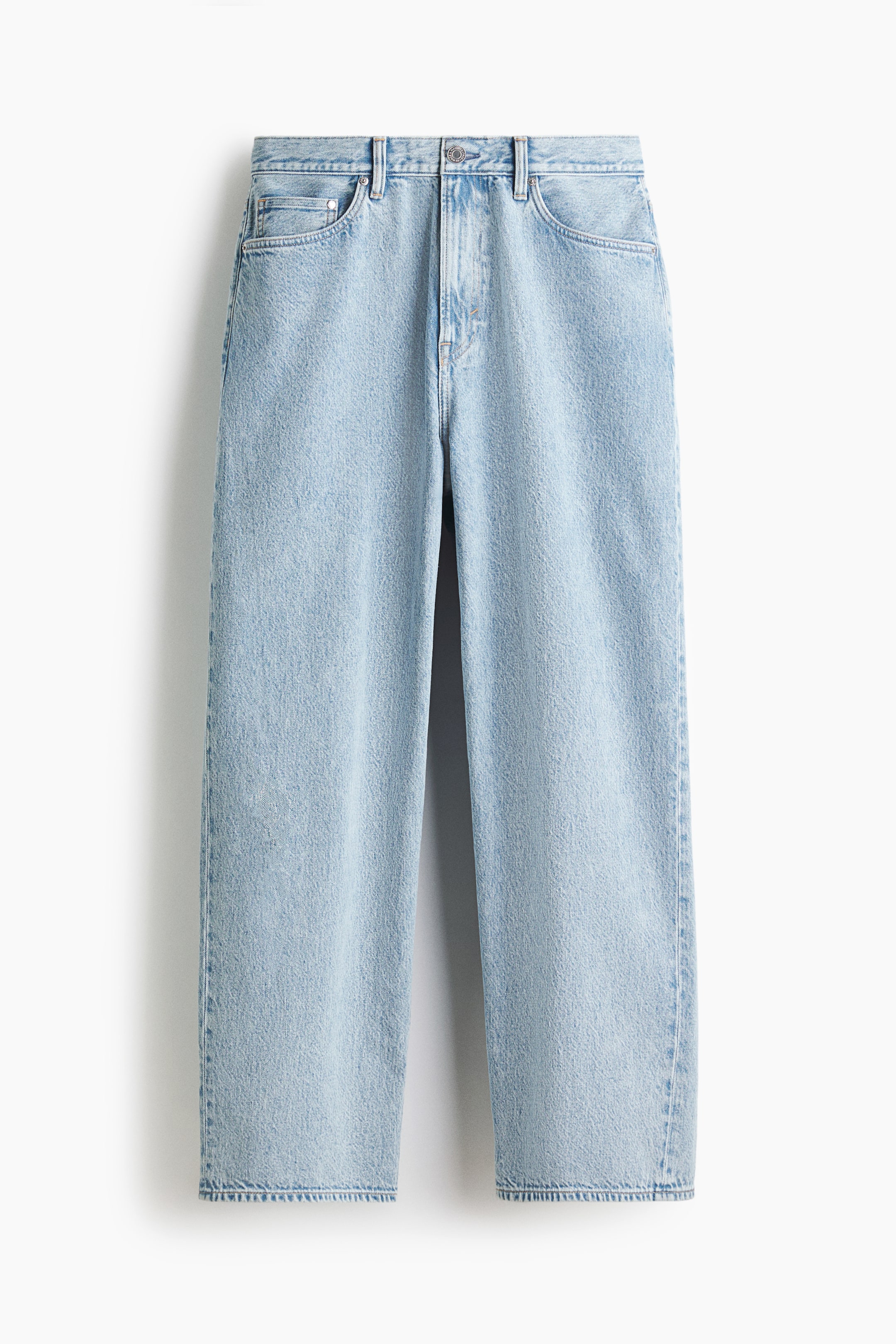 View larger image: FRONT view of light wash 5-pocket jeans, made from rigid cotton denim. The jeans feature a regular waist, a zip fly, and a baggy fit with rounded legs, offering ample room from the seat to the hem.