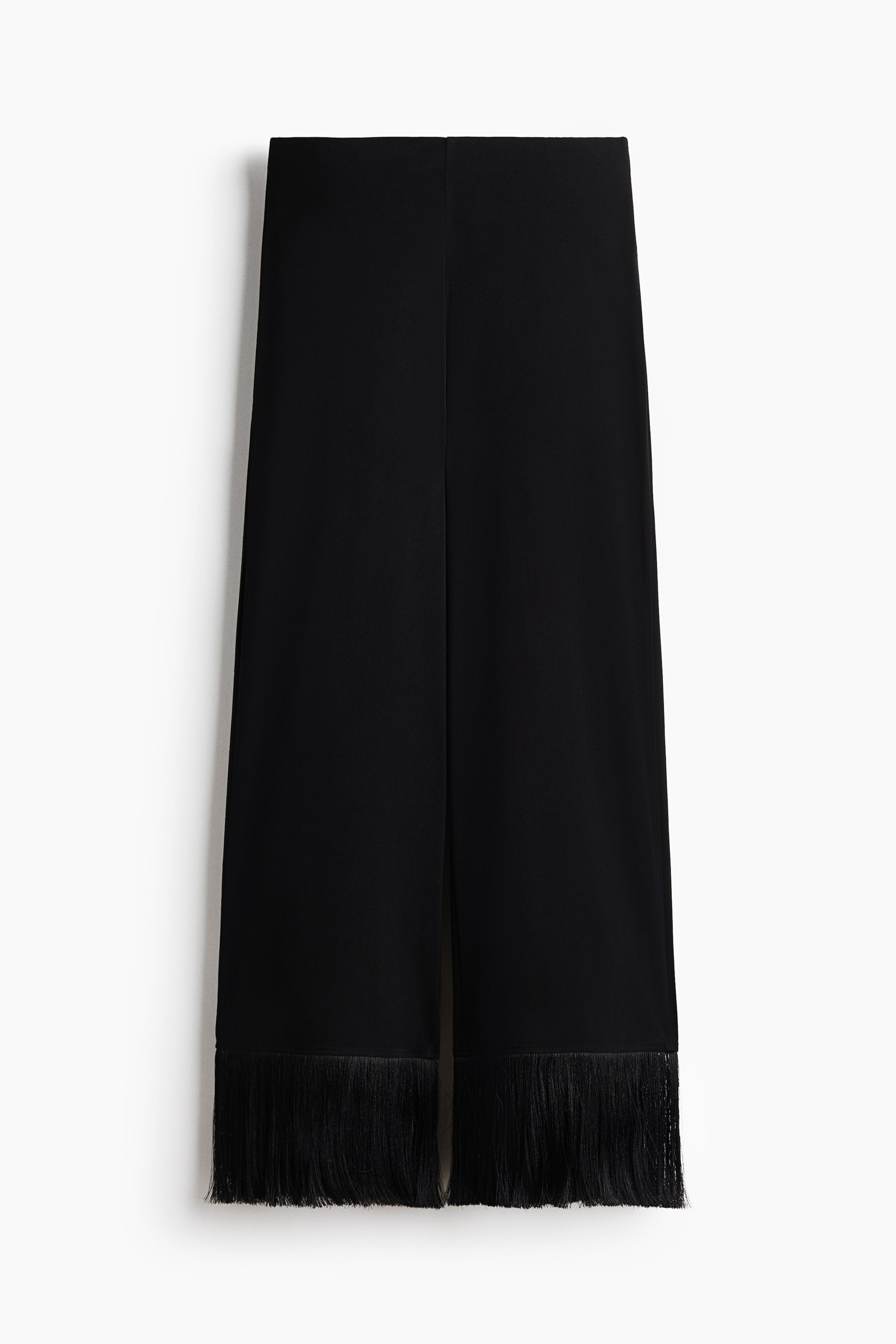 View larger image: A pair of black pants, viewed from the front, features a flat waistband and a straight, wide-leg cut. Each leg showcases a central front seam and dense black fringe detailing along the bottom hem.