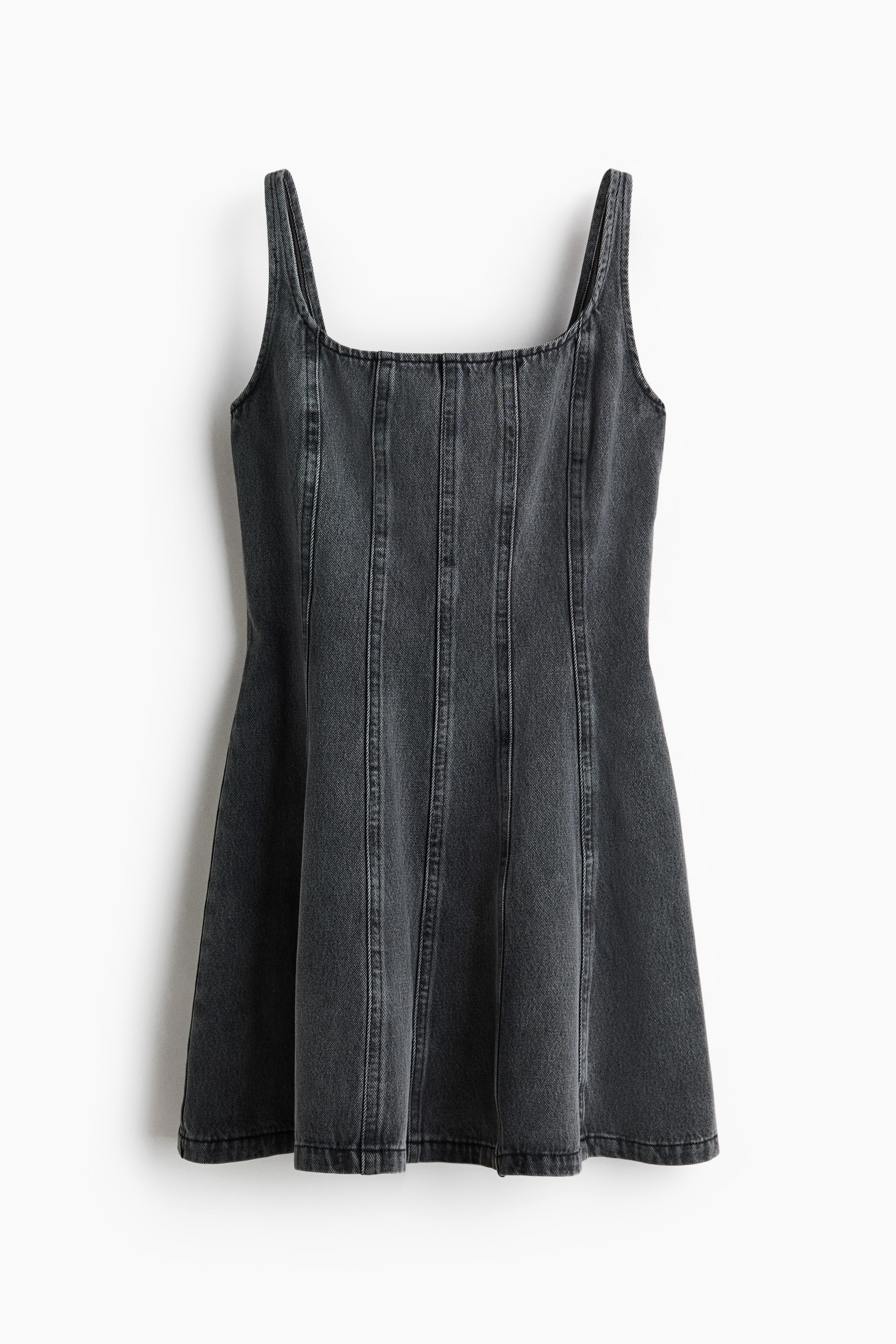 View larger image: A faded black denim mini dress is showcased FRONT, boasting a square neckline and wide shoulder straps. Vertical panel seaming accentuates the bodice and skirt, cascading down to a subtly flared hem.