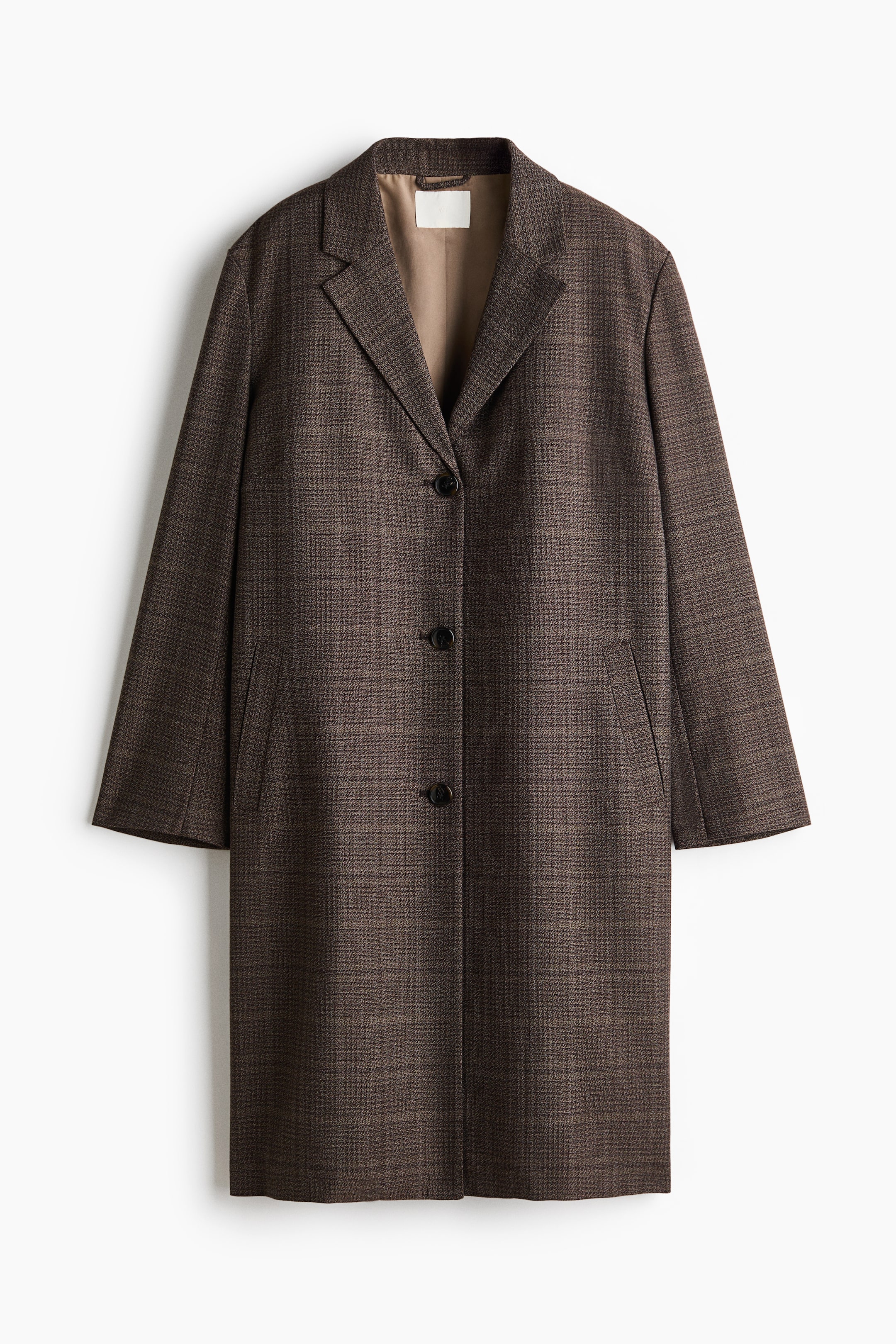 View larger image: A single-breasted, knee-length coat in a dark brown plaid pattern is hanging flat and facing forward. The garment showcases notch lapels, a three-button front closure, welt side pockets, and a tan inner lining visible at the collar.