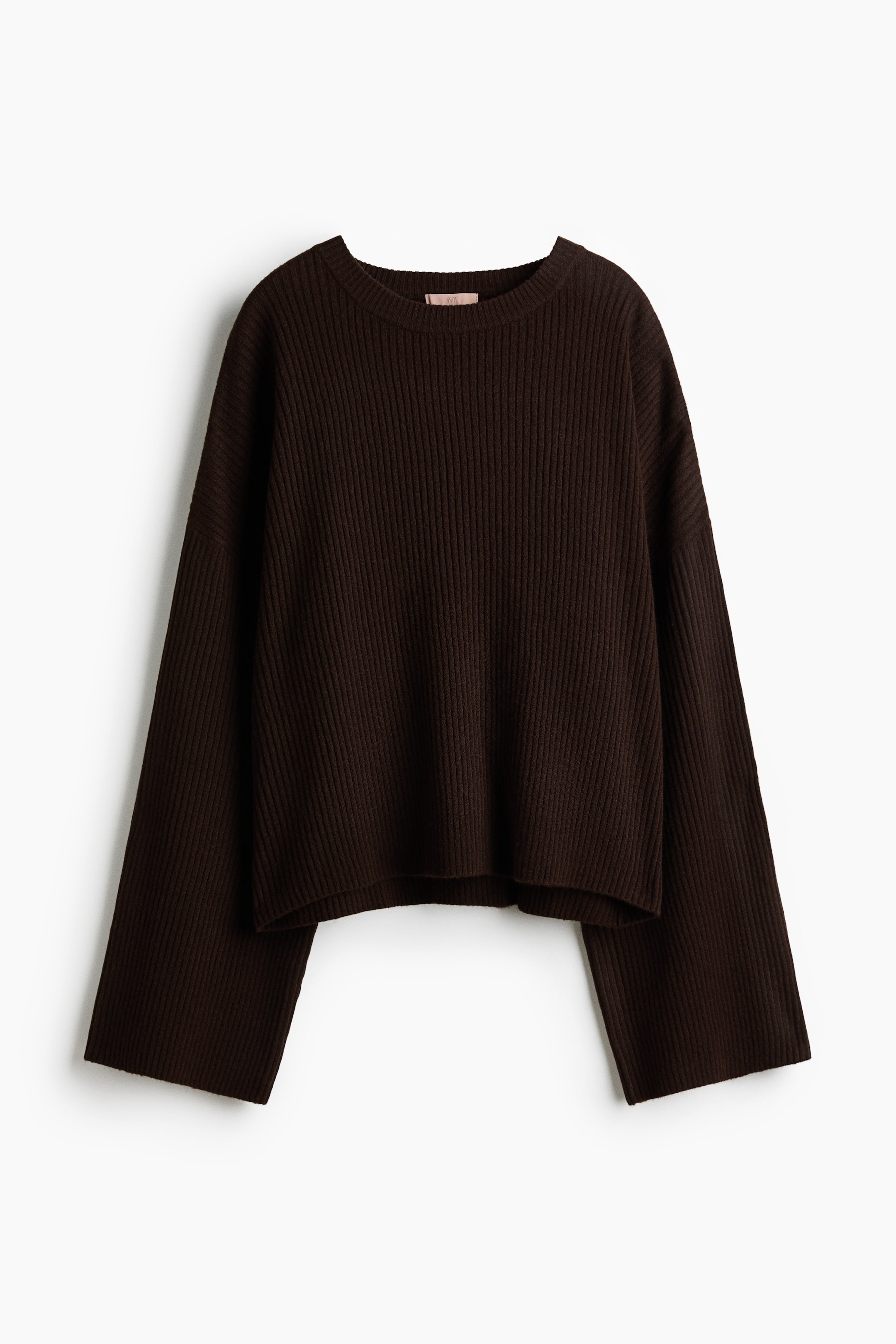 View larger image: The dark brown ribbed knit sweater is laid flat and front facing, featuring a round neckline and long, wide sleeves with unbanded hems.