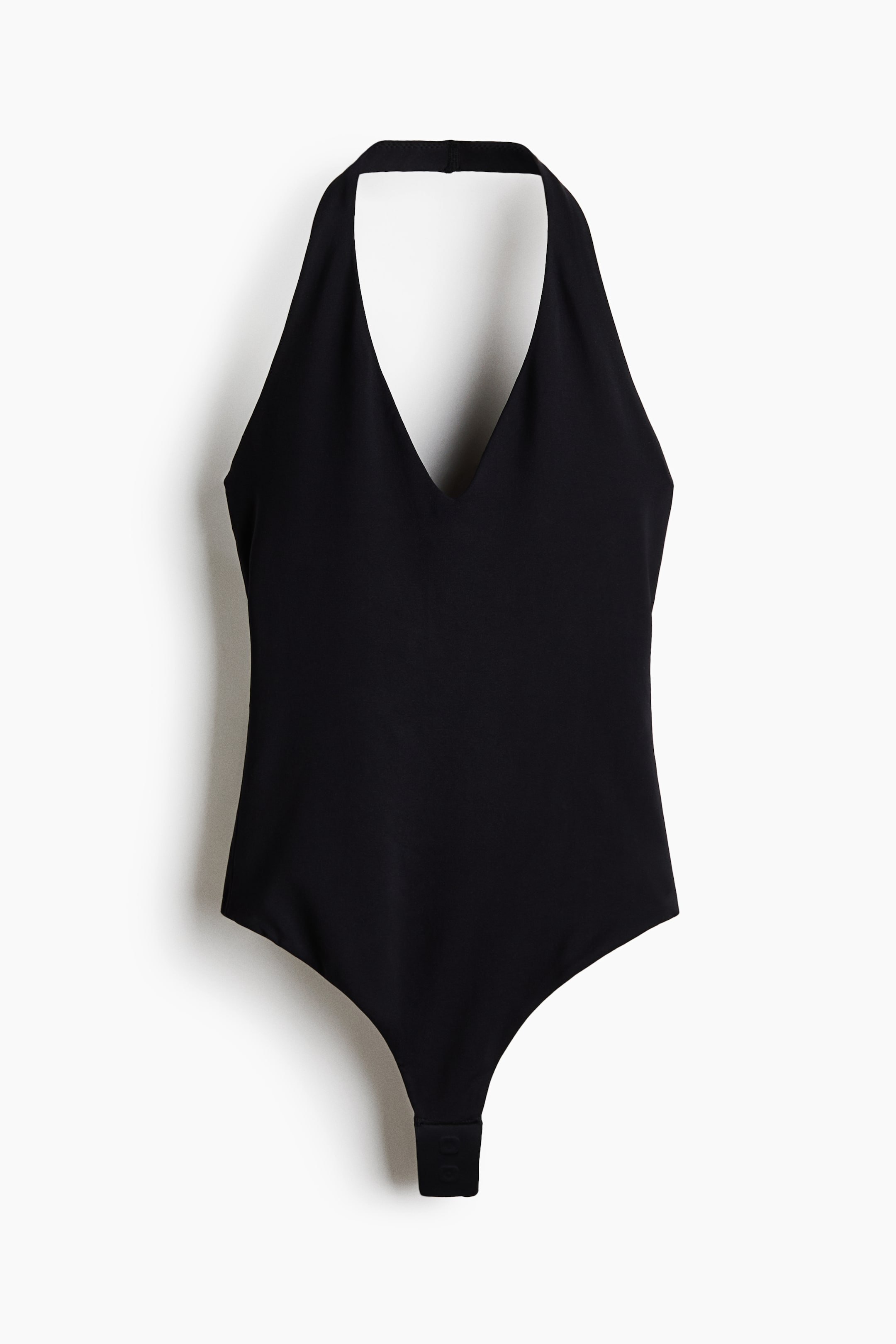 View larger image: Black bodysuit featuring a deep V-neckline, halter straps, and a sleeveless design, with a snap closure visible at the crotch.