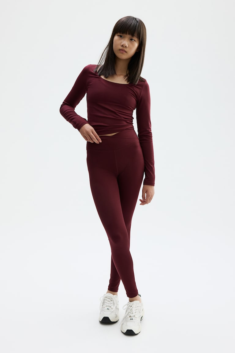 Sports leggings in SoftMove™ Burgundy Kids H&M IE