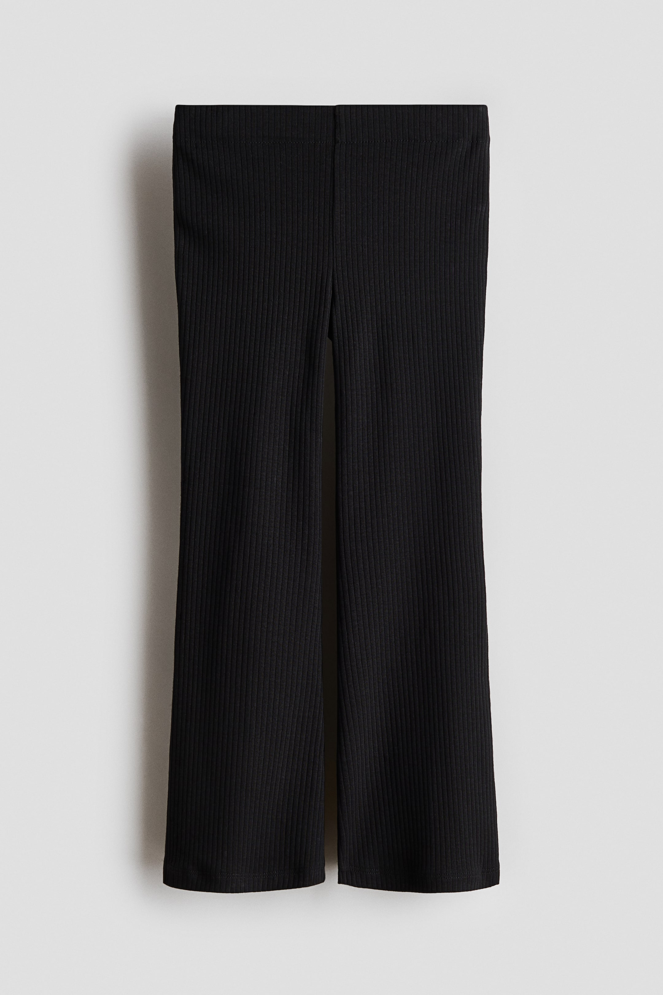 View larger image: "Black ribbed leggings are showcased FRONT, with an elasticated waist and flared legs."