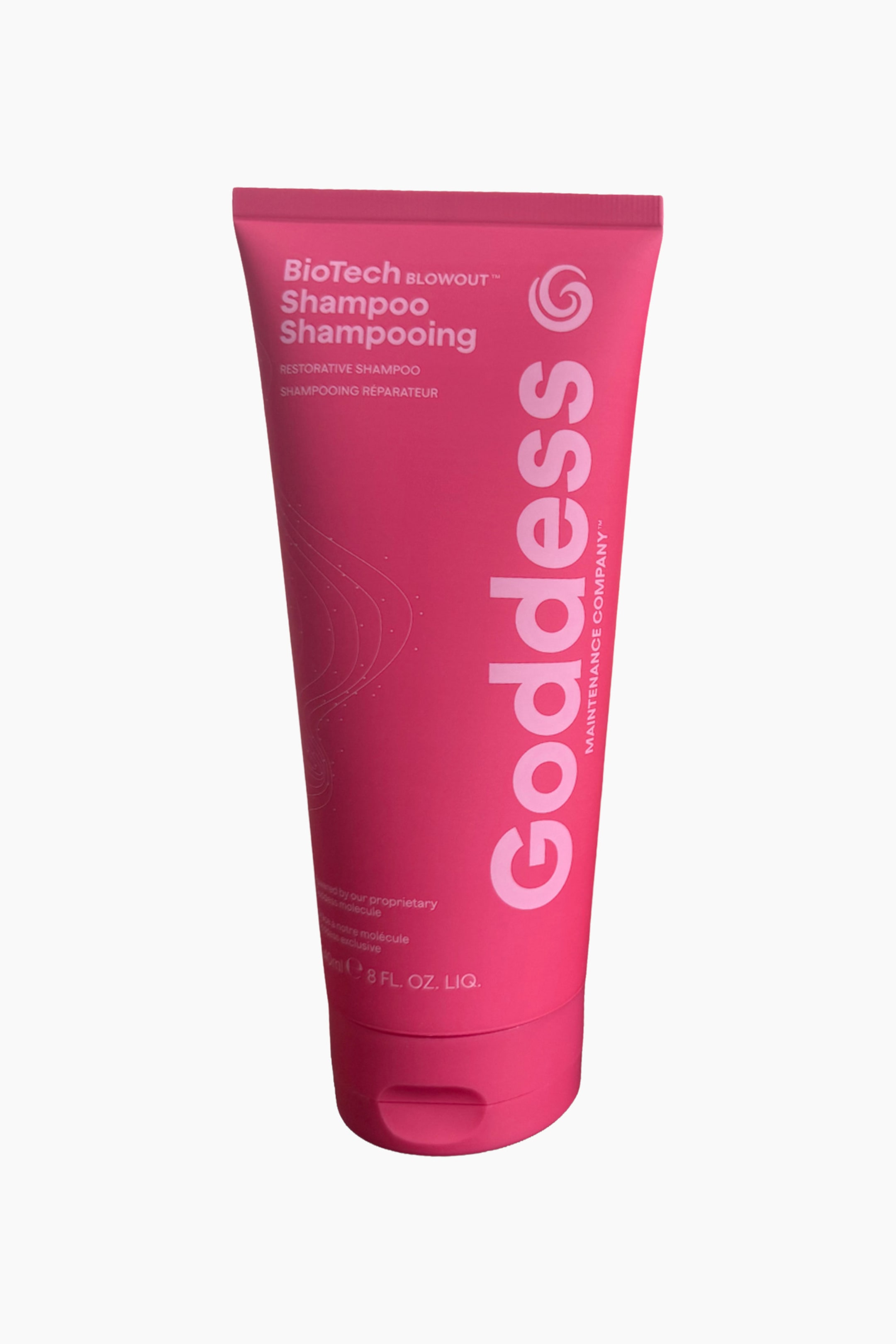 Visa större bild: En klarrosa BioTech Blowout Goddess Restorative Shampoo-klämtub är lätt vinklad åt höger, med texterna "Shampoo" och "Restorative Shampoo" på framsidan, "Goddess" skrivet vertikalt längs dess högra sida, och ett platt klafflock syns vid dess bas.