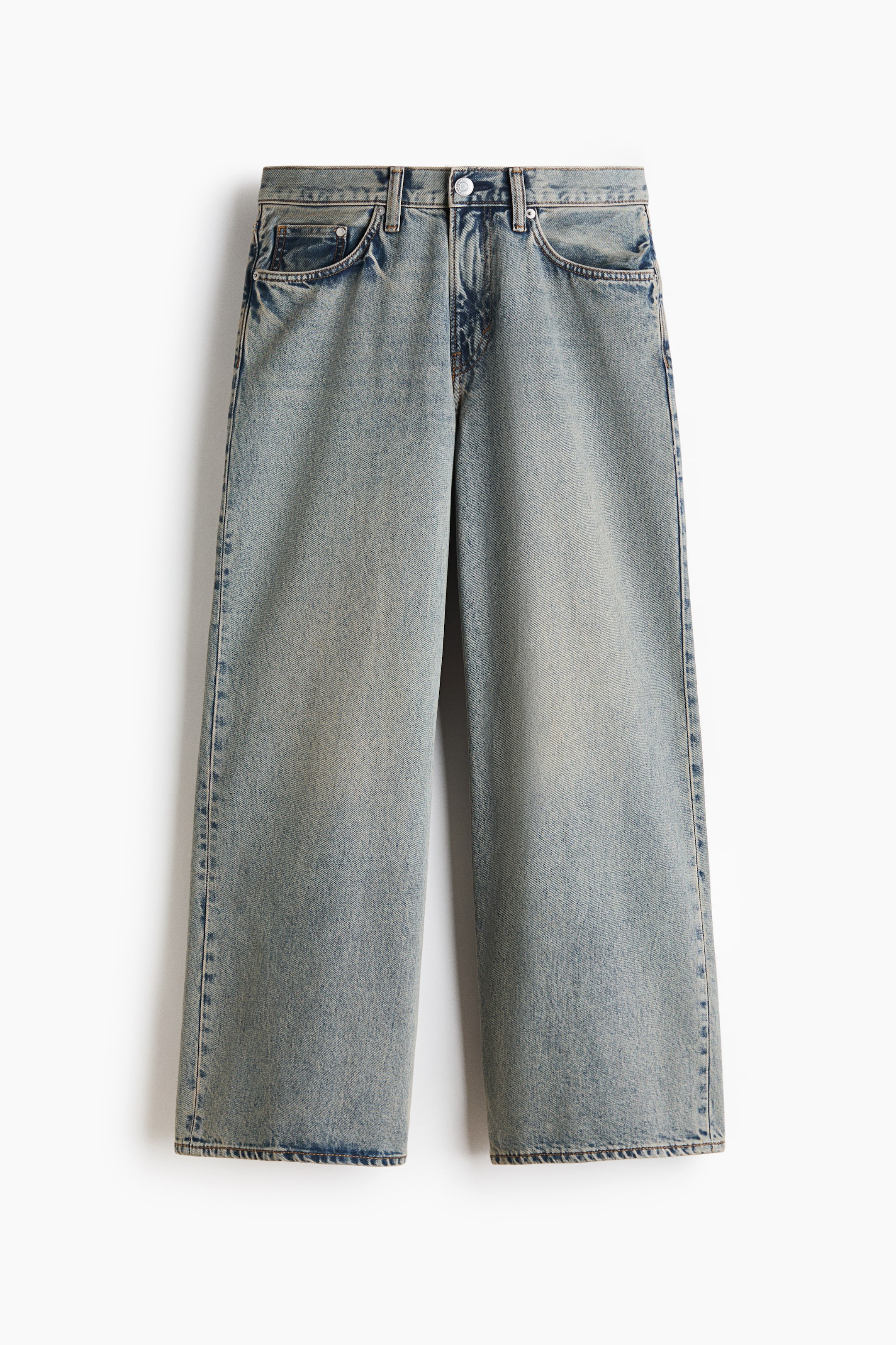 View larger image: A pair of light blue wash denim jeans is shown from the front, featuring a regular waist, a classic five-pocket design, and wide, loose-fitting legs. The jeans display a faded wash effect with a button-and-zip fly closure.