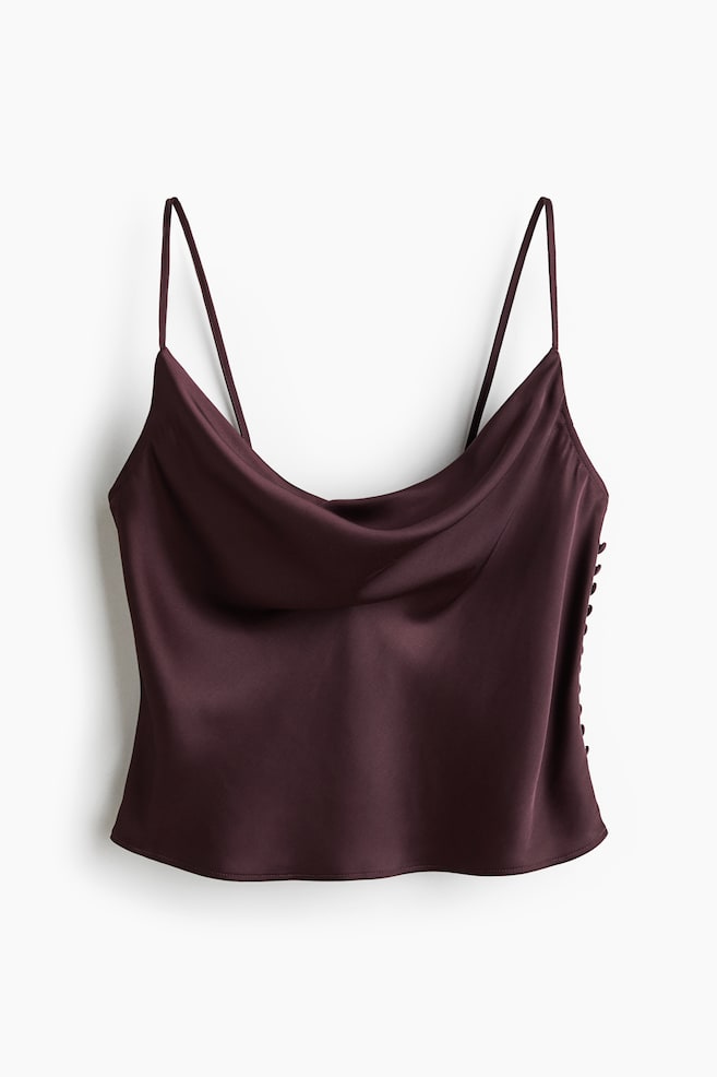 A front-facing dark red-brown satin camisole top featuring a draped cowl neckline and thin spaghetti straps. Small fabric-covered buttons run down the right side seam. - 1