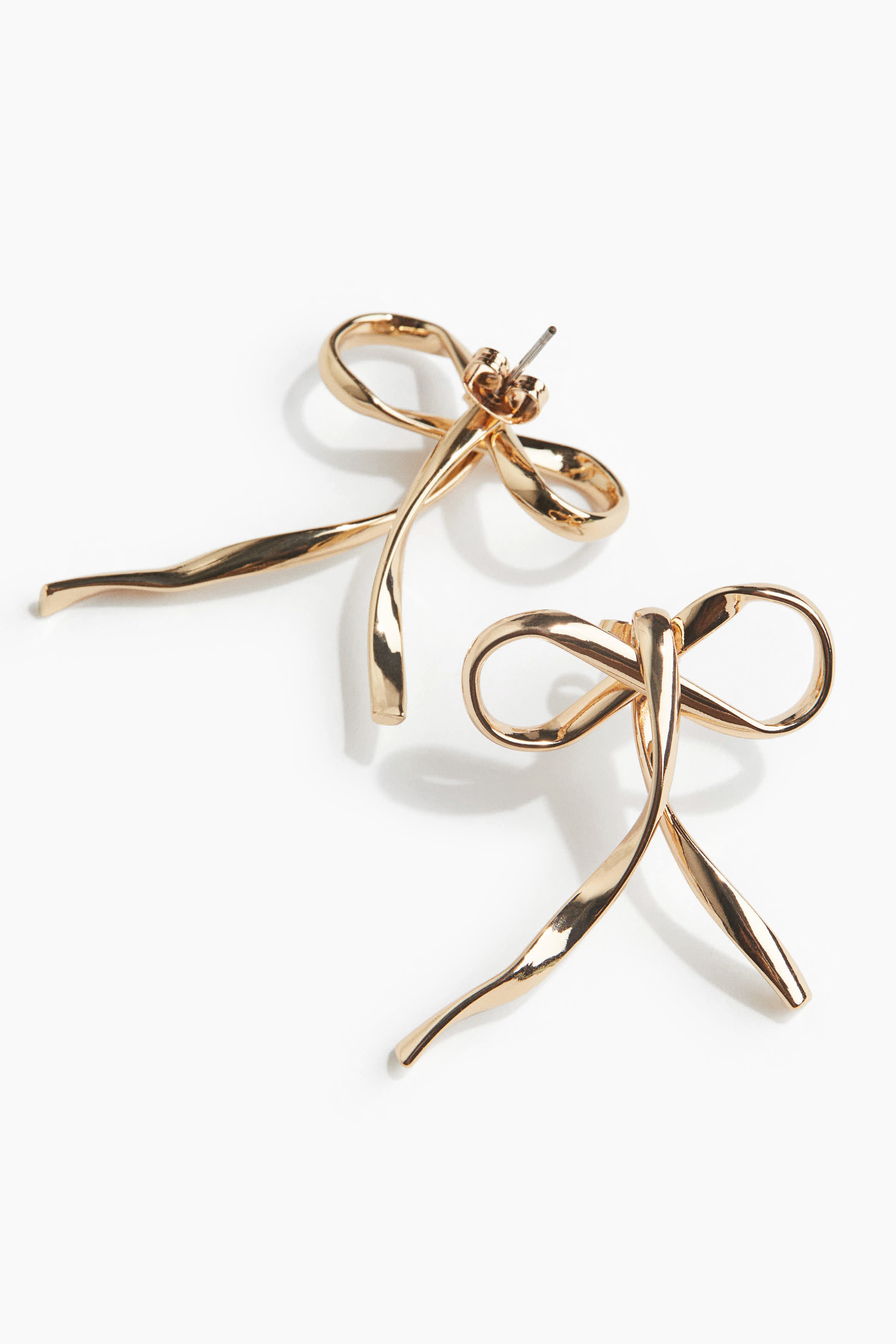 Bow-shaped earrings - Gold-coloured