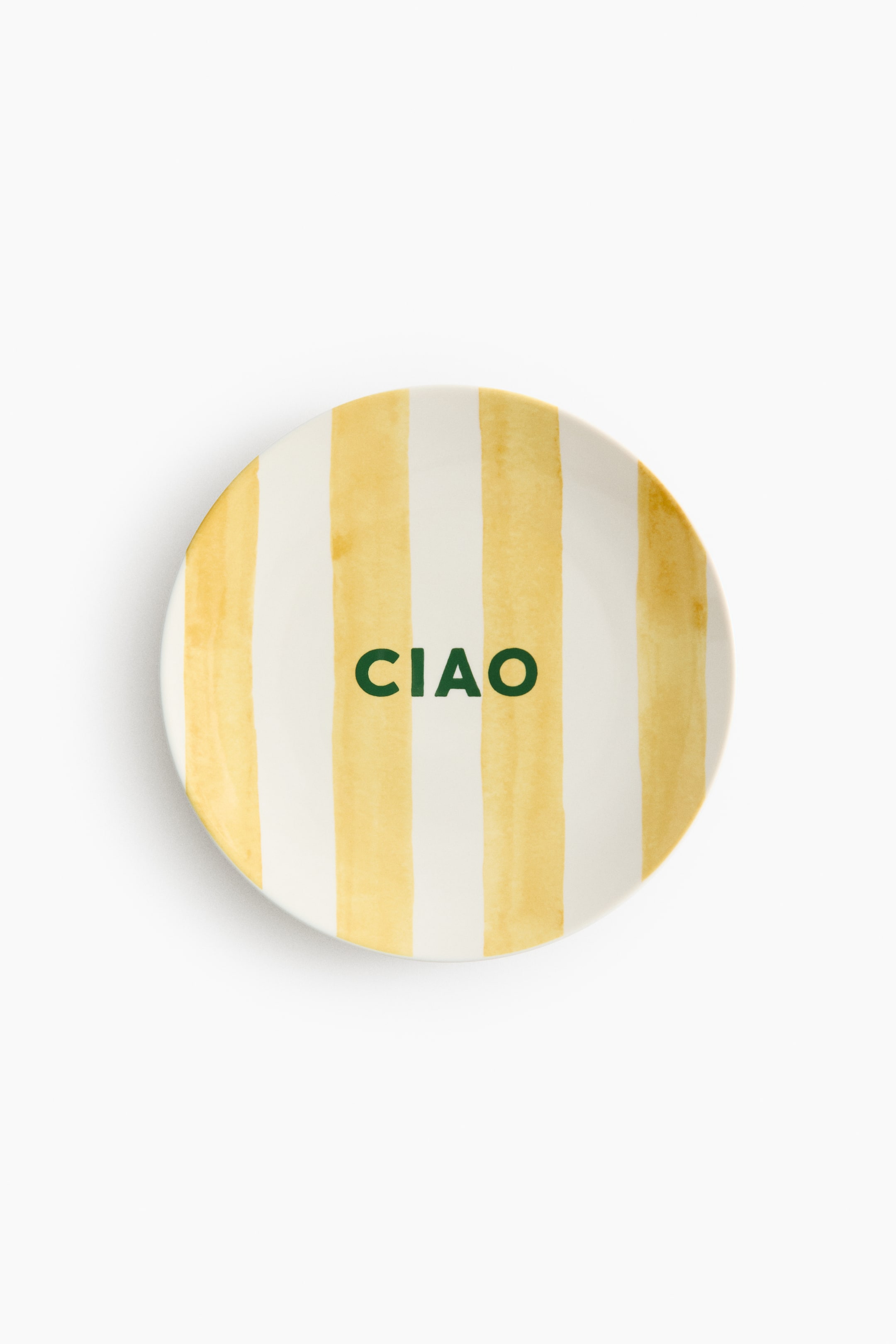 View larger image: A medium porcelain plate features vertical yellow watercolor-style stripes on a white background. The word "CIAO" is prominently displayed in green capital letters.