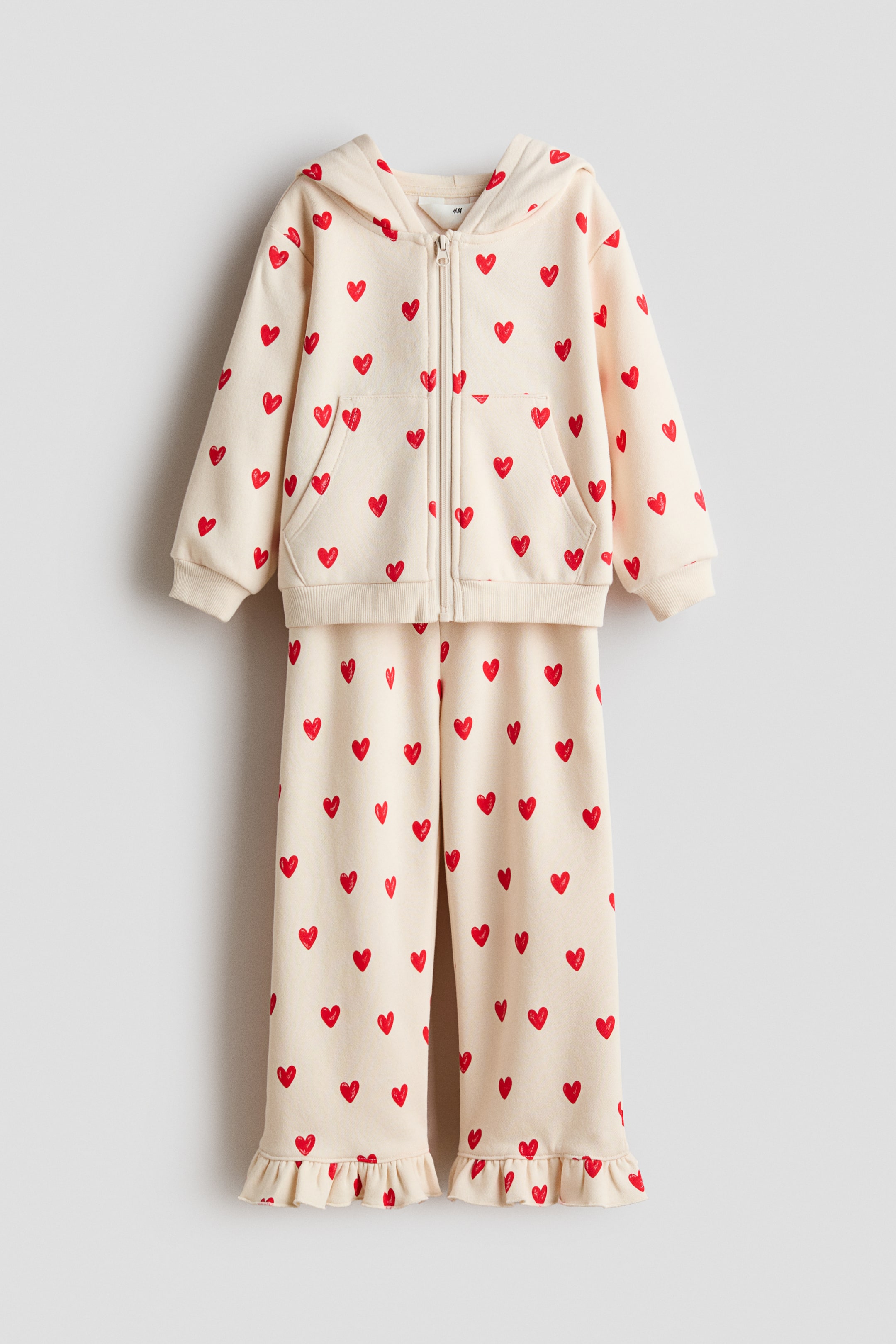 Ampliar la imagen: 2-piece printed sweatshirt set - Beige claro/Corazones - Kids | H&M MX 1