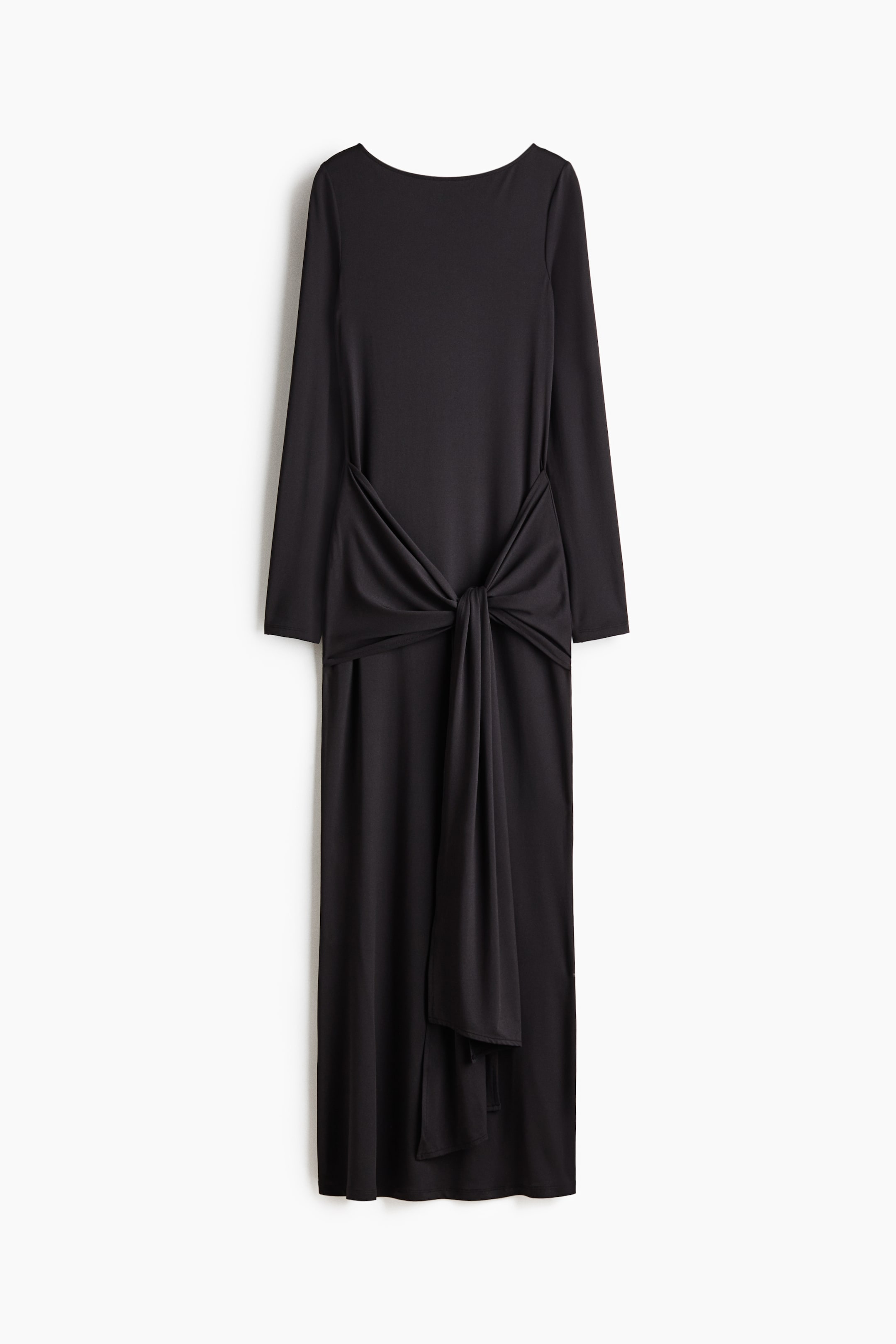 Zobrazit větší obrázek: Dlouhé, přiléhavé černé šaty ze strečového žerzeje jsou zachyceny ZEPŘEDU, s lodičkovým výstřihem, dlouhými rukávy a širokým dílem v oblasti boků, který se vpředu zavazuje a vytváří tak nařasený (drapovaný) efekt.