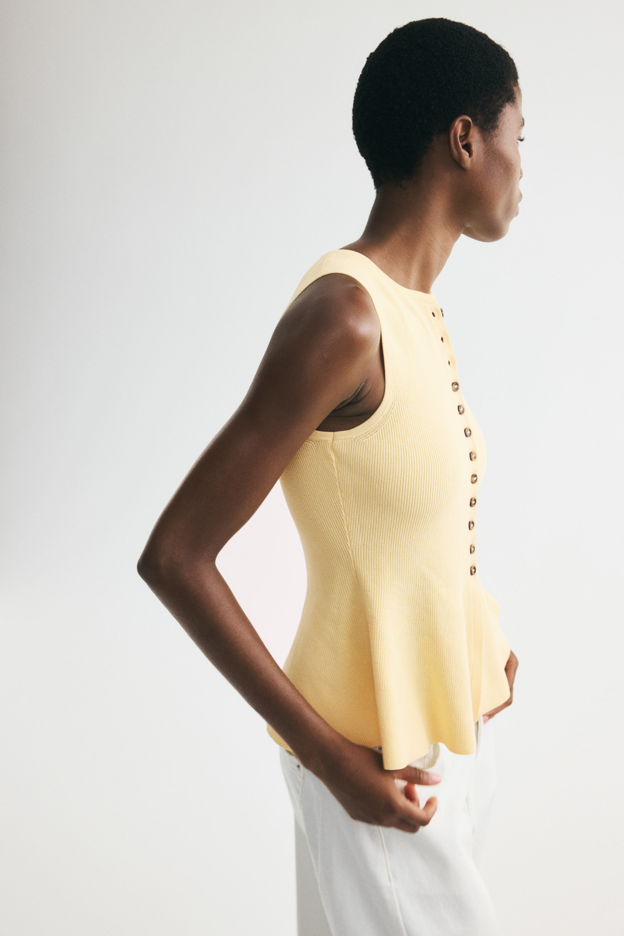 Rib-Knit Peplum Sleeveless Top