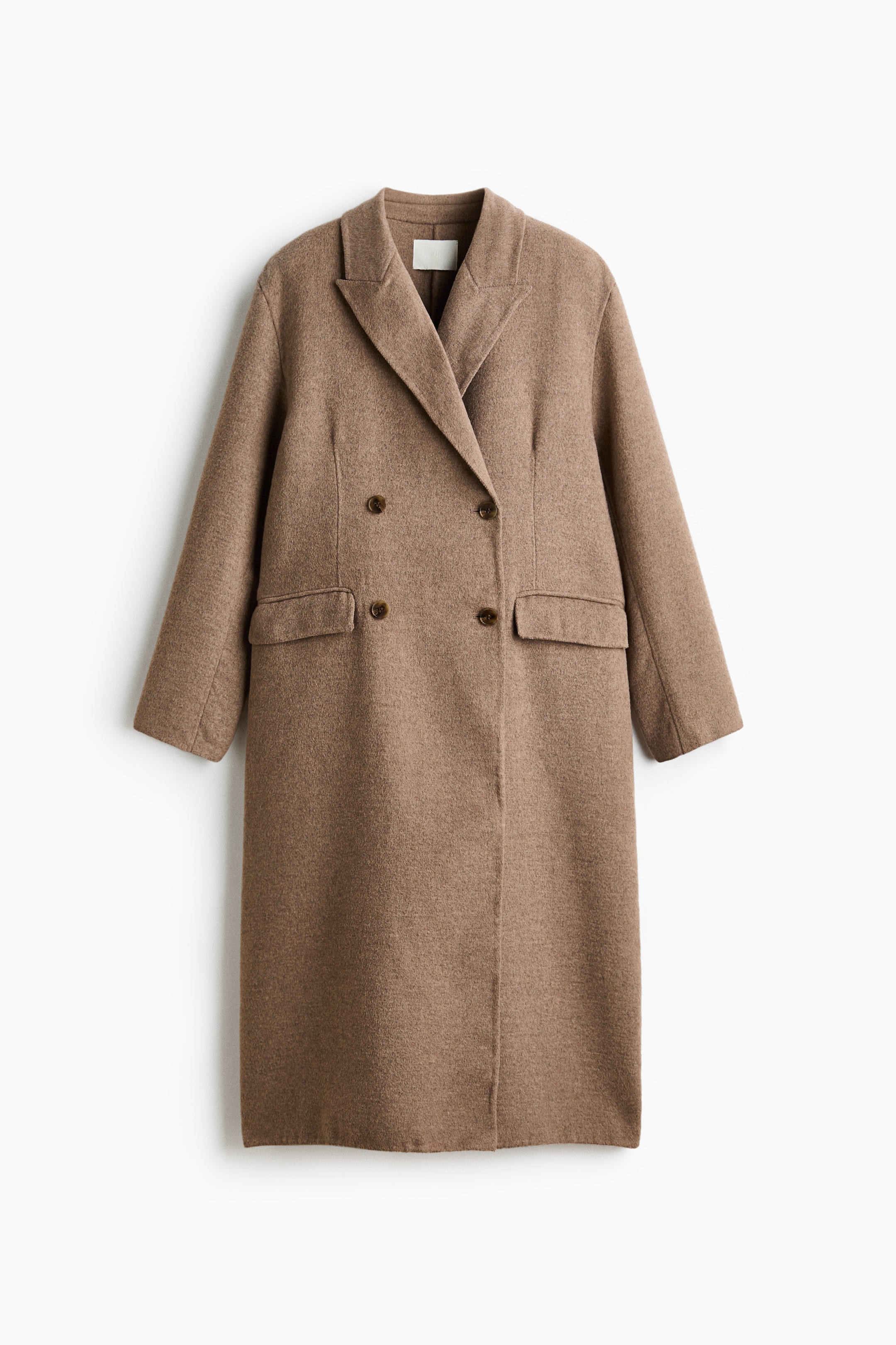 View larger image: A brown double-breasted coat is shown from the front, featuring wide notch lapels and four dark brown buttons. It includes two flap pockets at the hip, long sleeves, and falls to a midi length.
