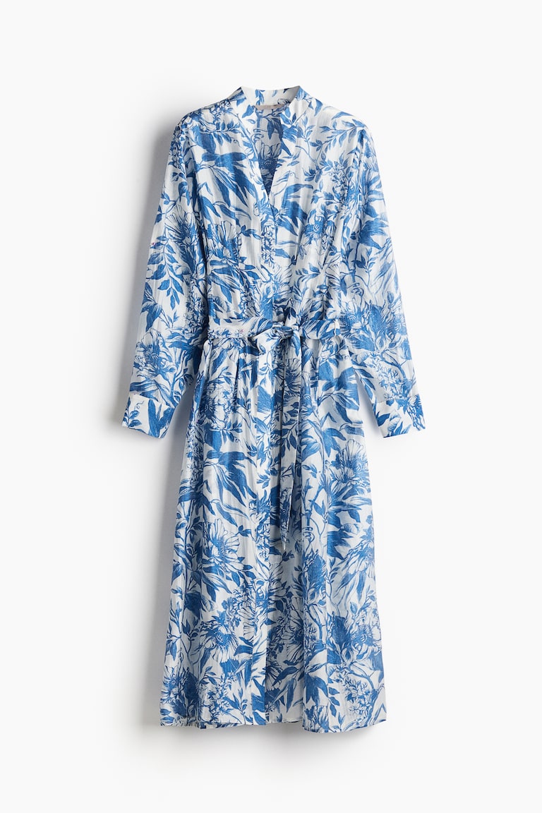 blue blouse dress with flowers cuffed sleeves Women's Floral Ruffle Trim Top | Avara or denim for a polished Women's White/Blue floral Tie-belt shirt