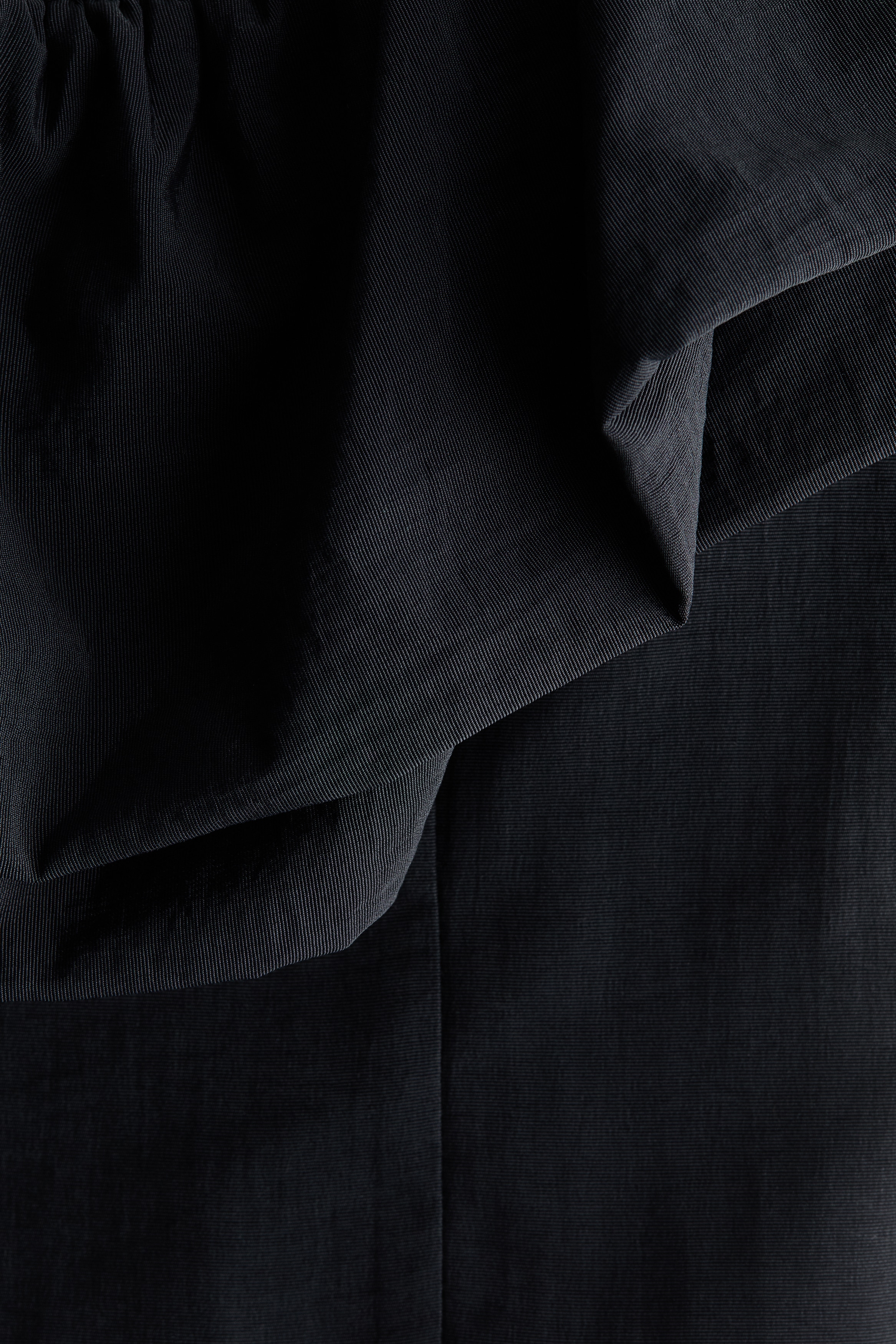 Frill-trimmed off-the-shoulder top