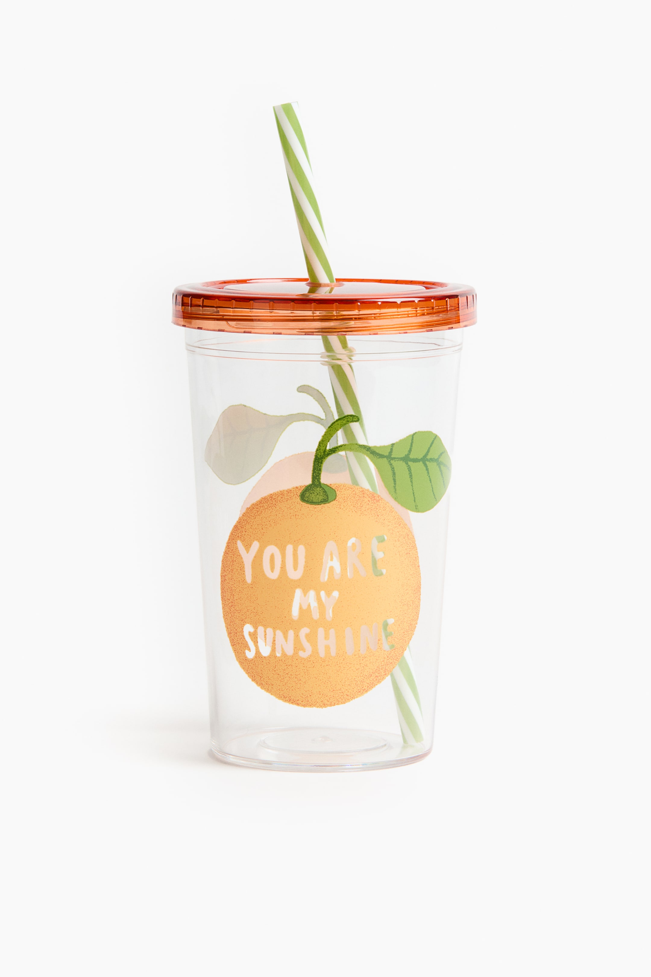 View larger image: A transparent plastic mug is shown from the front, featuring an orange screw-top lid and a green-and-white striped straw. The surface displays an orange fruit design with green leaves and the text "YOU ARE MY SUNSHINE".