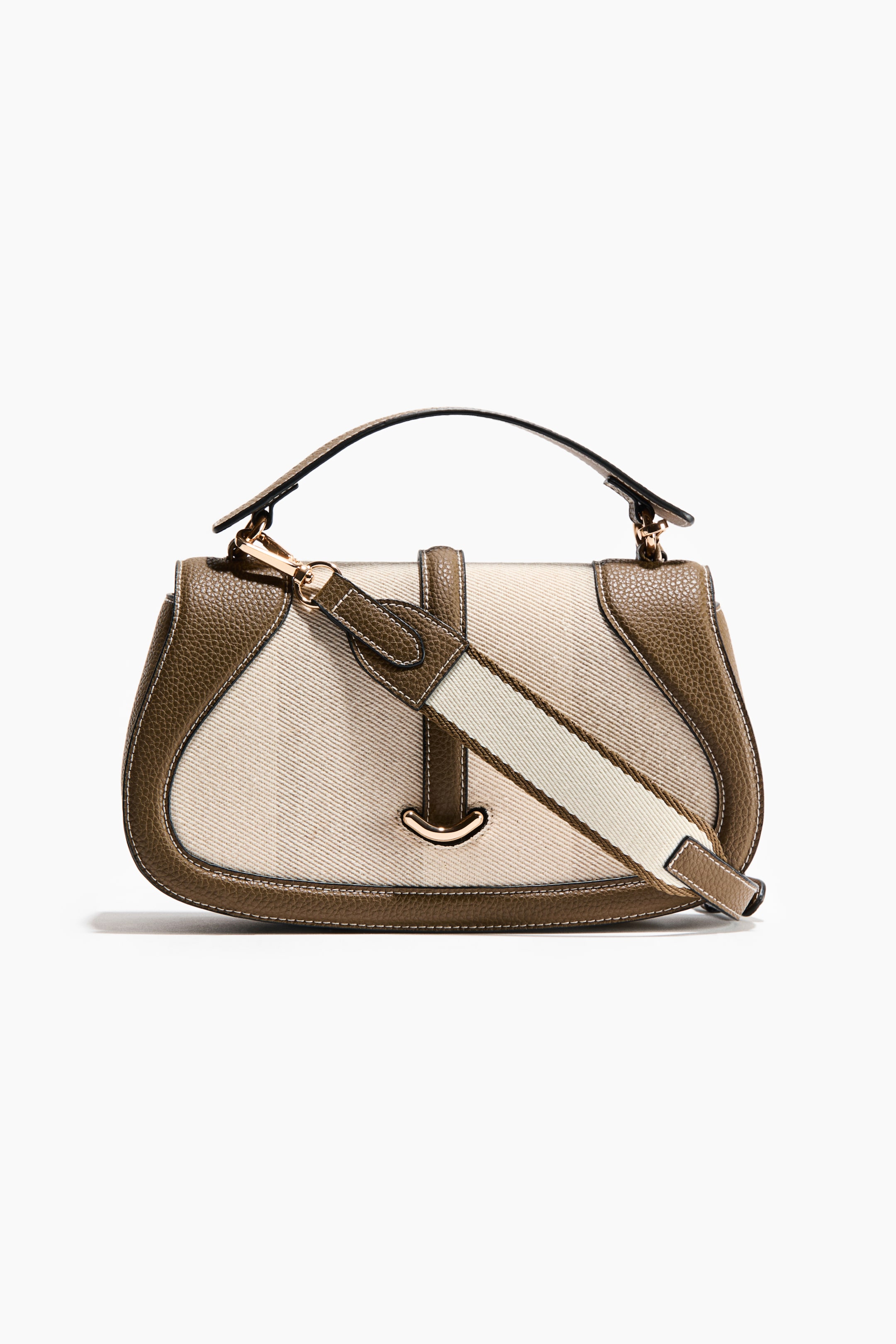 View larger image: The handbag is presenting its front, featuring a structured design with dark olive green textured leather borders, a central beige canvas panel, a top handle, a detachable striped fabric shoulder strap, and gold-tone hardware.
