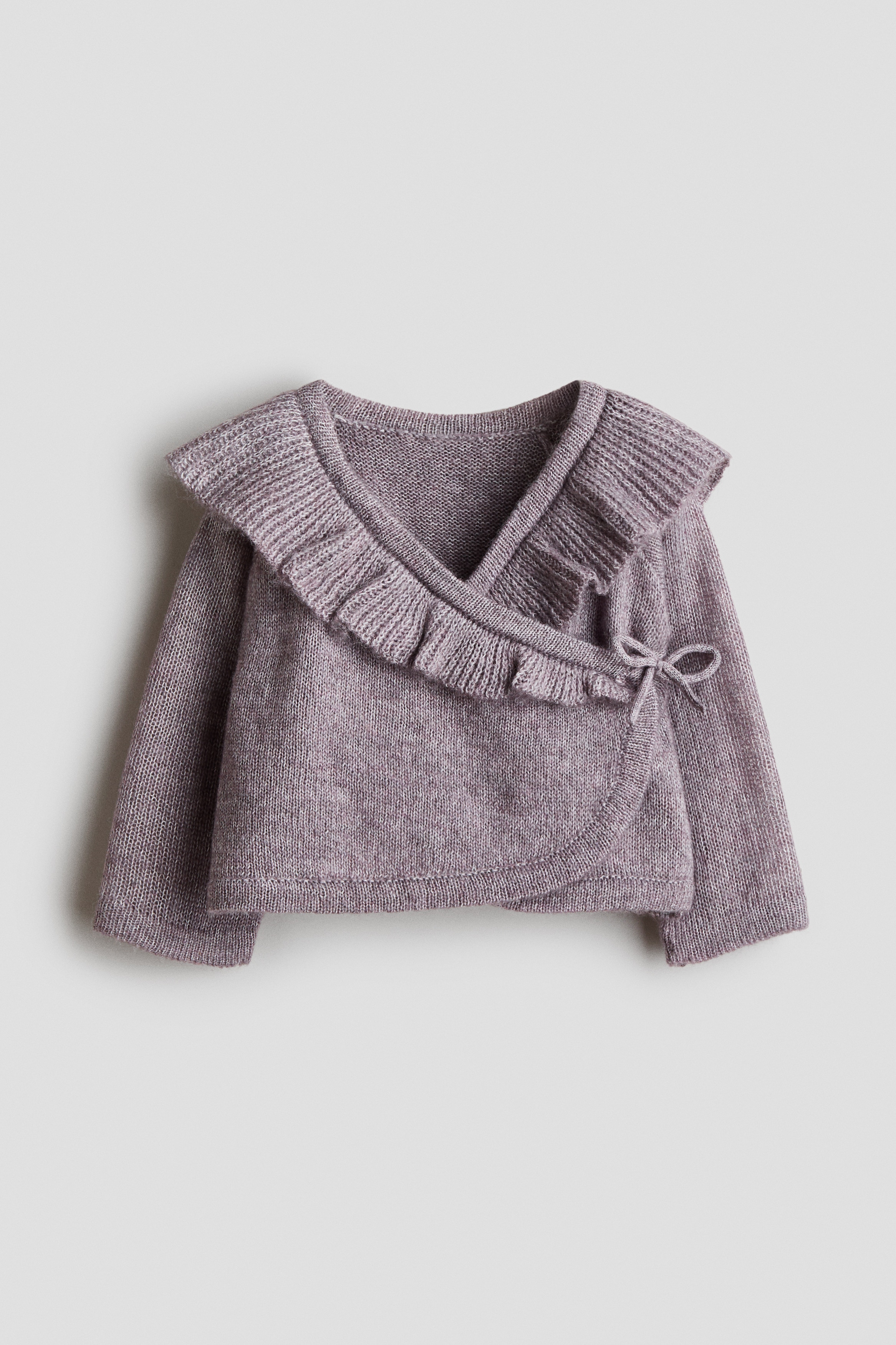 Frill-trimmed wrapover cardiganModel