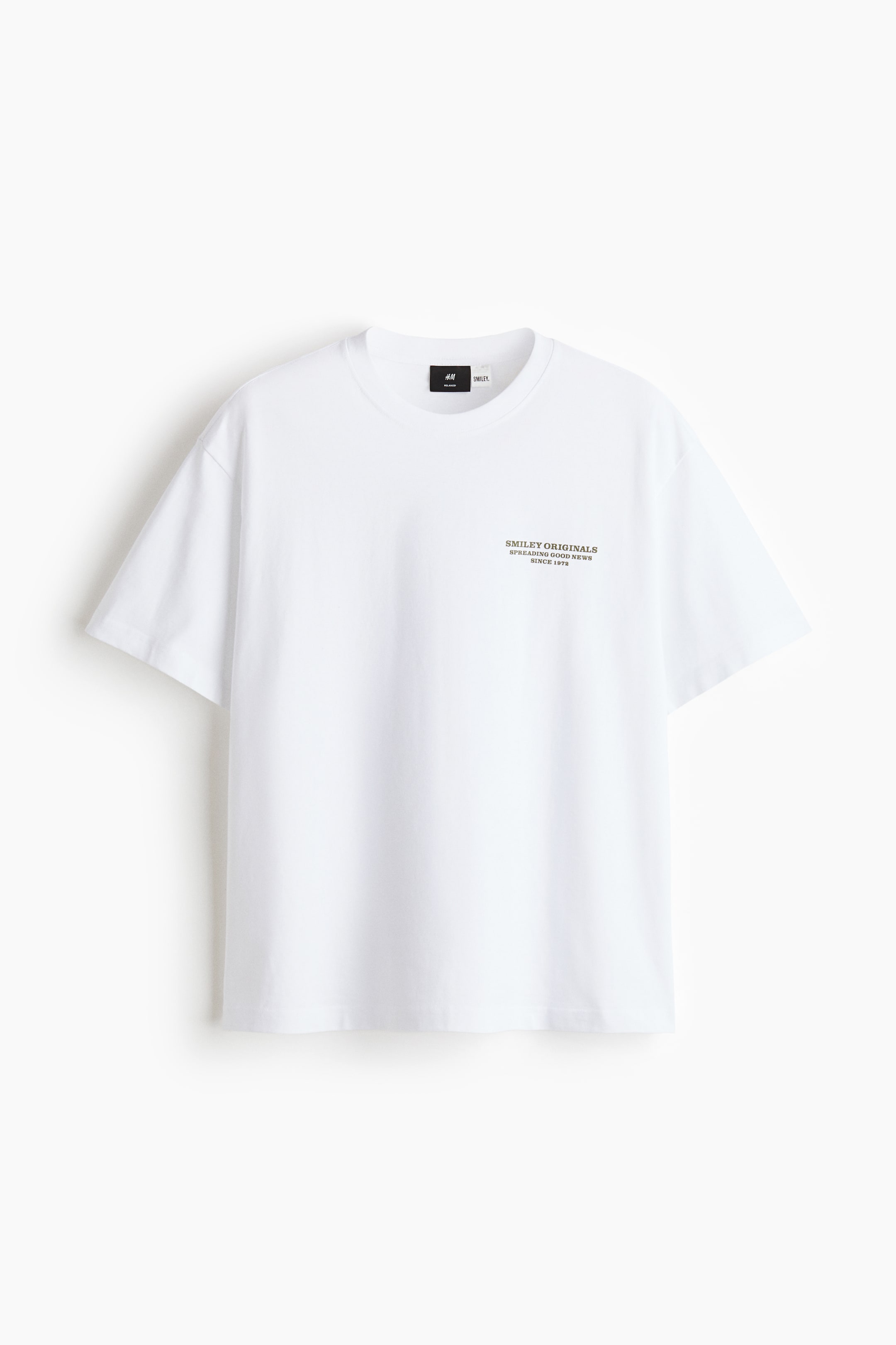 View larger image: A white T-shirt is facing forward, featuring a round neckline with a narrow trim and dropped shoulders. It showcases a loose fit with a generous but not oversized silhouette, and a small dark text print on the left chest.