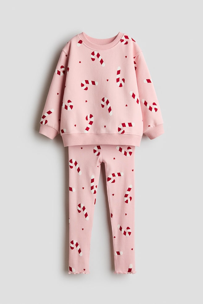 2-delat set med sweatshirt och leggings - Ljusrosa/Polkagriskäppar/Vit/Hjärtan - 1