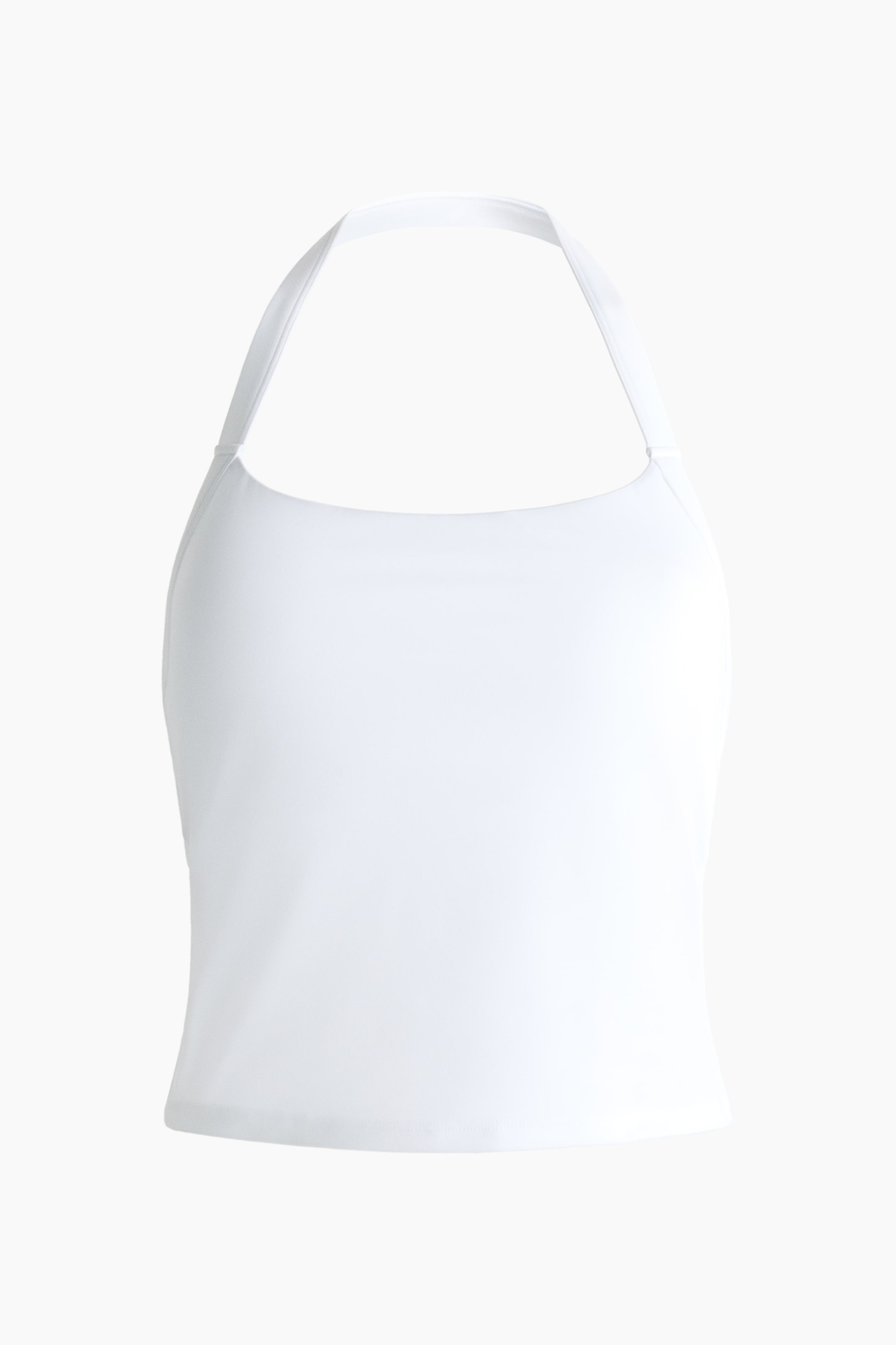 View larger image: A white halterneck sports vest top showcases a sleek, form-fitting design from a front view. It features a single narrow strap forming the halterneck neckline.