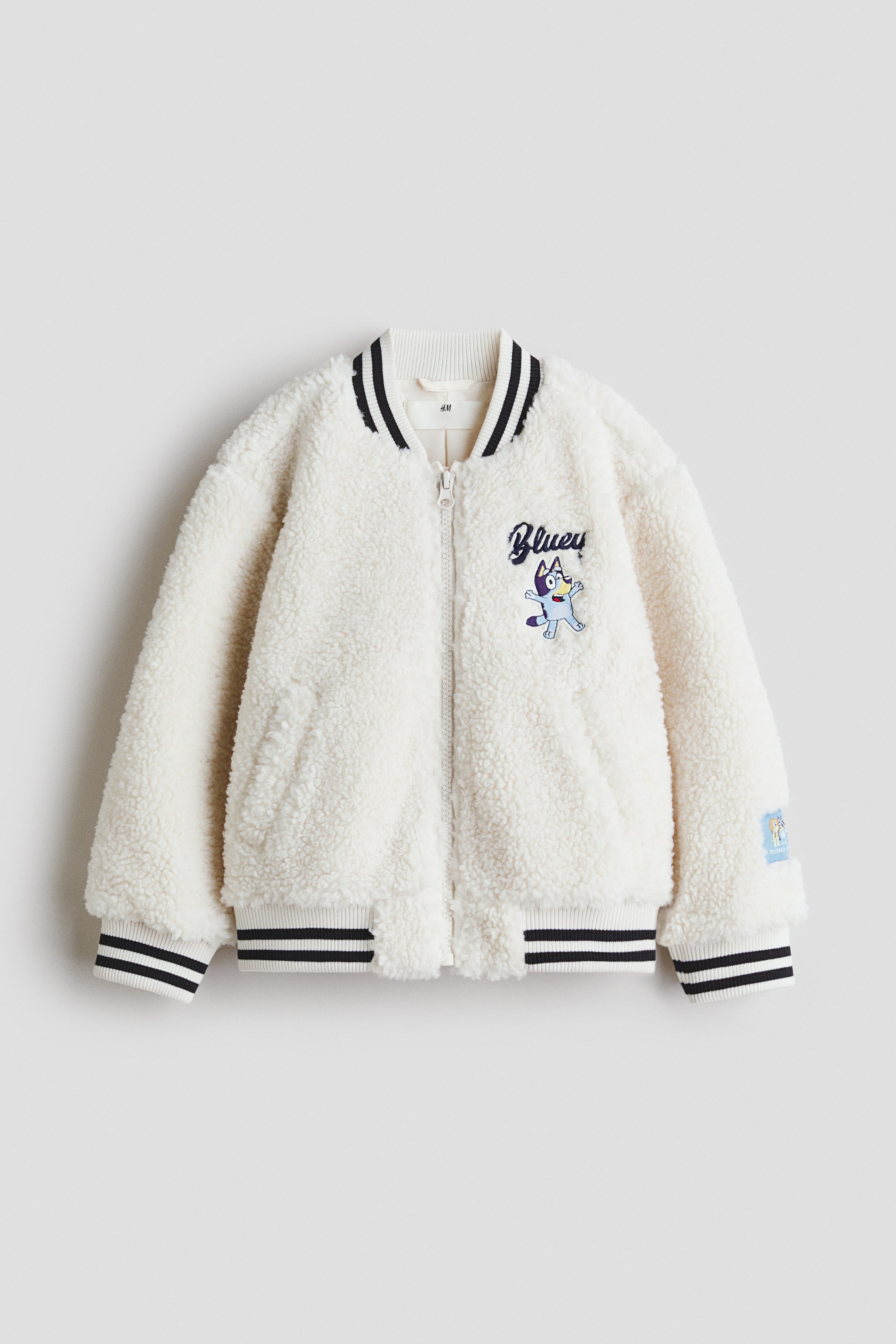 Ampliar la imagen: Teddy baseball jacket - Crema/Bluey - Kids | H&M MX 1